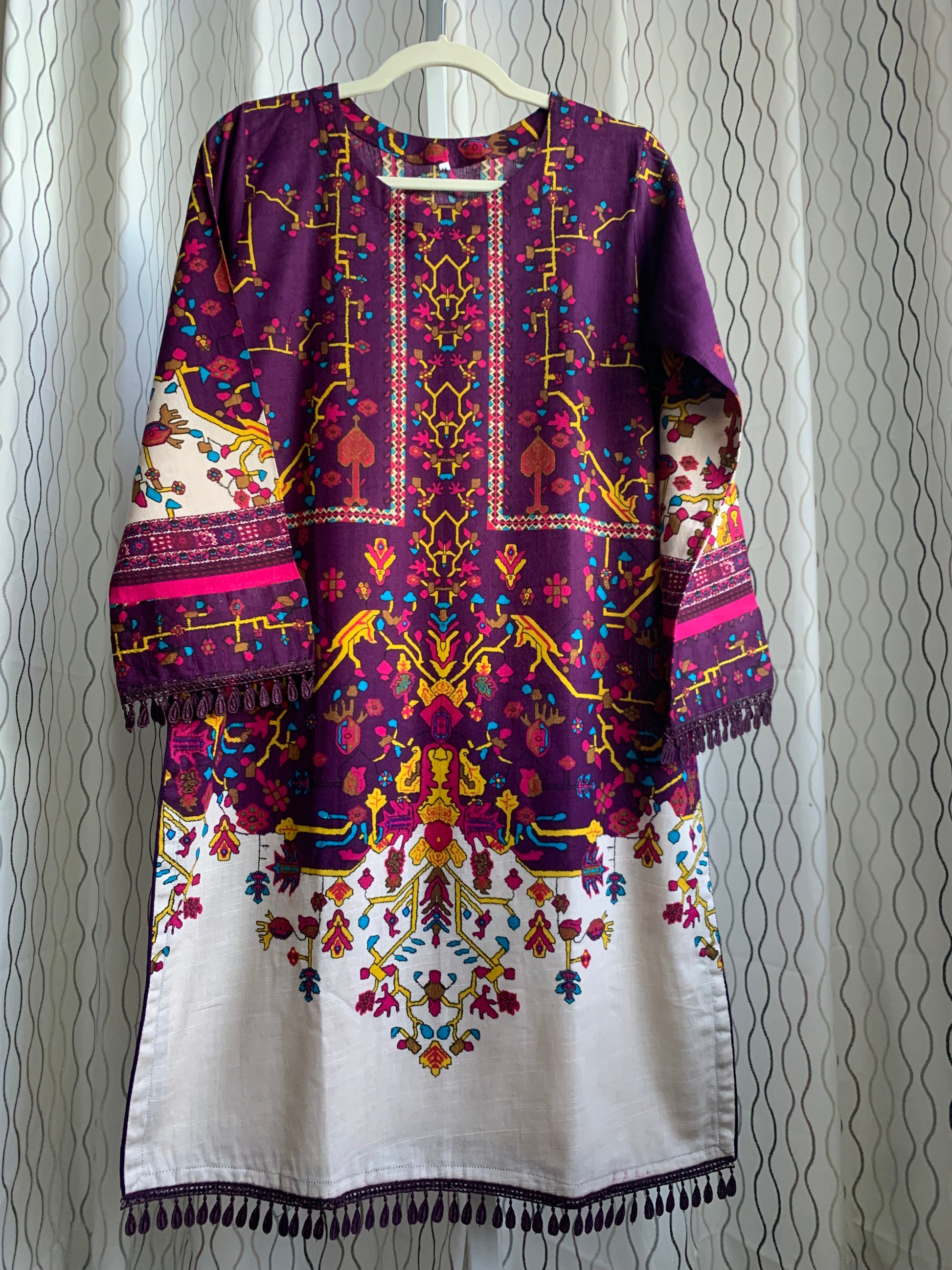 Modest Khaddar Suit for Women:  it offers a Modest Style along with Custom Stitch. Crafted with Exotic Khaddar Fabric, which is a blend of Organic Cotton and Wool Slub. This 3 piece suit includes one Tunic, matching Trouser and a full Shawl, perfect for the winter season. Available in Plum (Dark Purple) color and S-M-L-XL  sizes, and guarantees both comfort and elegance.