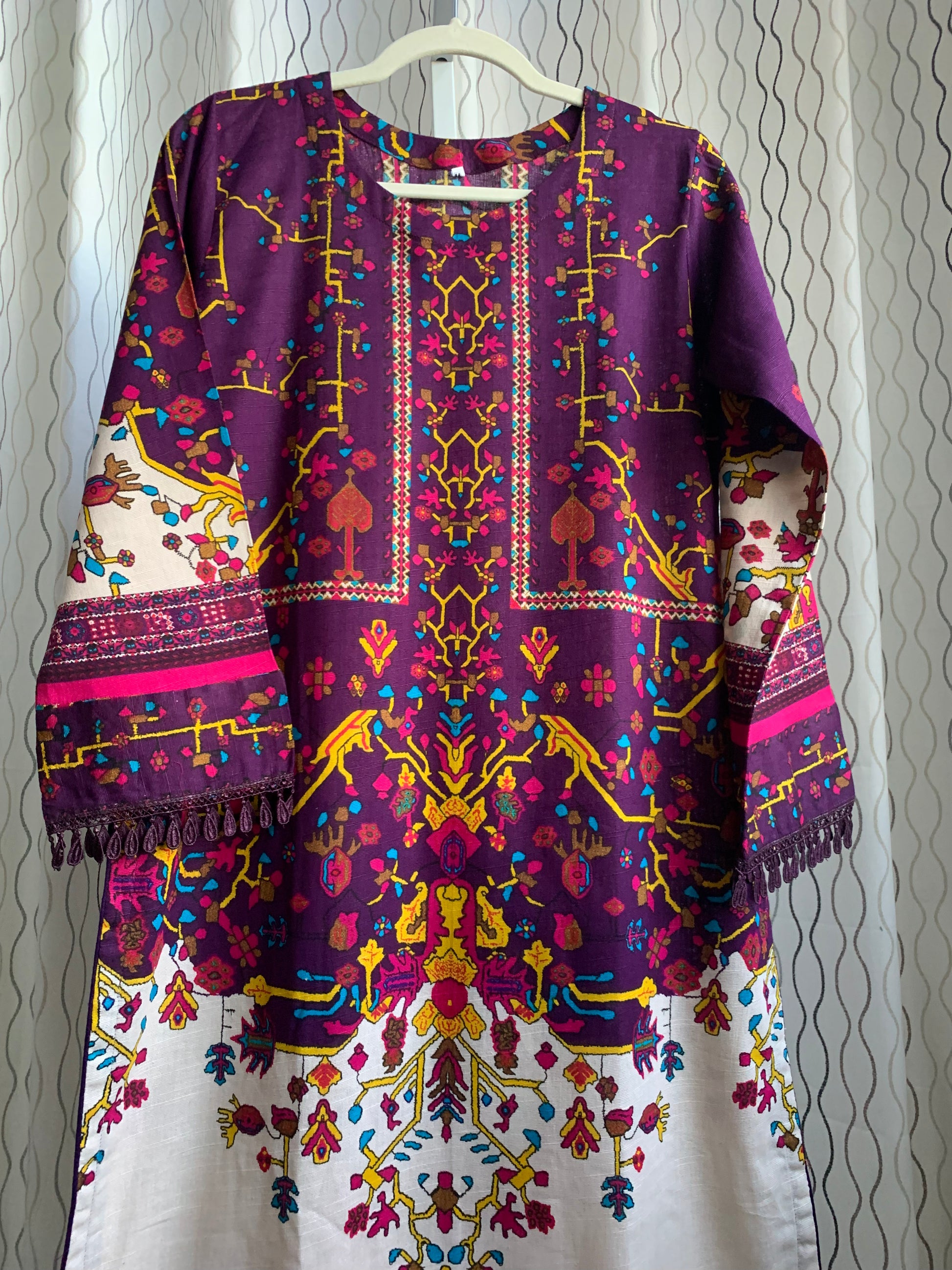 Modest Khaddar Suit for Women:  it offers a Modest Relax Fit Style along with Custom Stitch. Crafted with Exotic Khaddar Fabric, which is a blend of Organic Cotton and Wool Slub. This 3 piece suit includes one Tunic, matching Trouser and a full Shawl, perfect for the winter season. Available in Plum (Dark Purple) color and S-M-L-XL  sizes, and guarantees both comfort and elegance.
