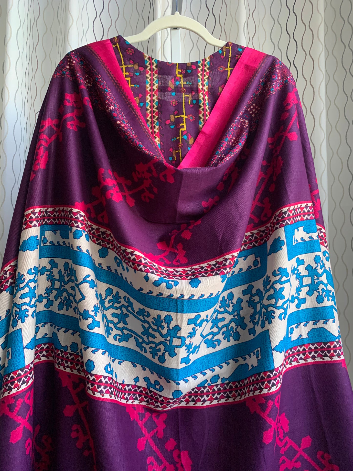 Modest Khaddar Suit for Women: it offers a Modest Style and Custom Stitch. Crafted with Exotic Khaddar Fabric, which is a blend of Organic Cotton and Wool Slub. This 3 piece suit includes one Tunic, matching Trouser and a full Shawl, perfect for the winter season. Available in Plum (Dark Purple) color and S-M-L-XL sizes, and guarantees both comfort and elegance.