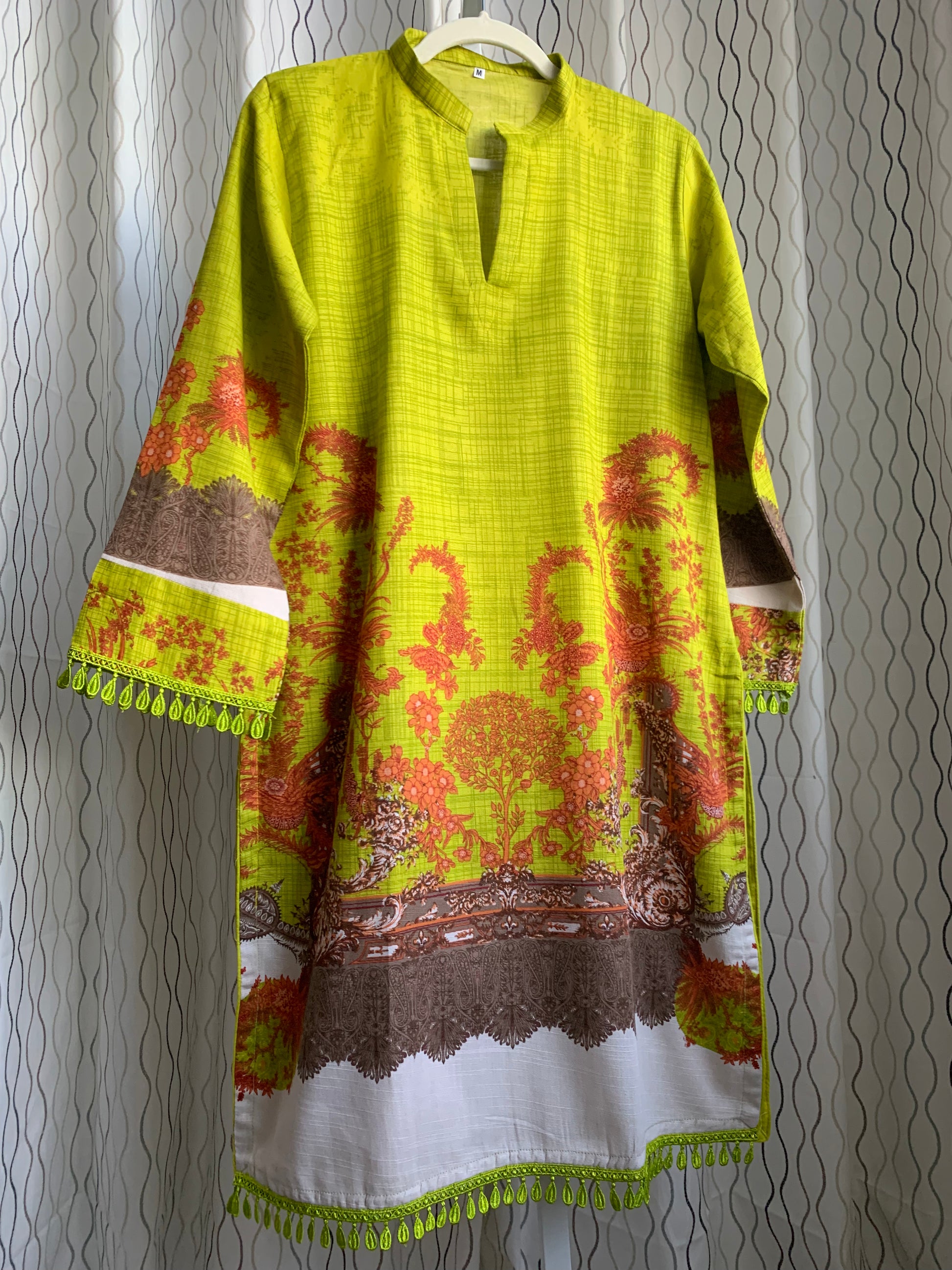 Modest Khaddar Suit for Women:  it offers a Modest Style and Custom Stitch. Crafted with Exotic Khaddar Fabric, which is a blend of Organic Cotton and Wool Slub. This 3 piece suit includes one Tunic, matching Trouser and a full Shawl, perfect for the winter season. Available in Lime Green color and S-M-L-XL  sizes, and guarantees both comfort and elegance.