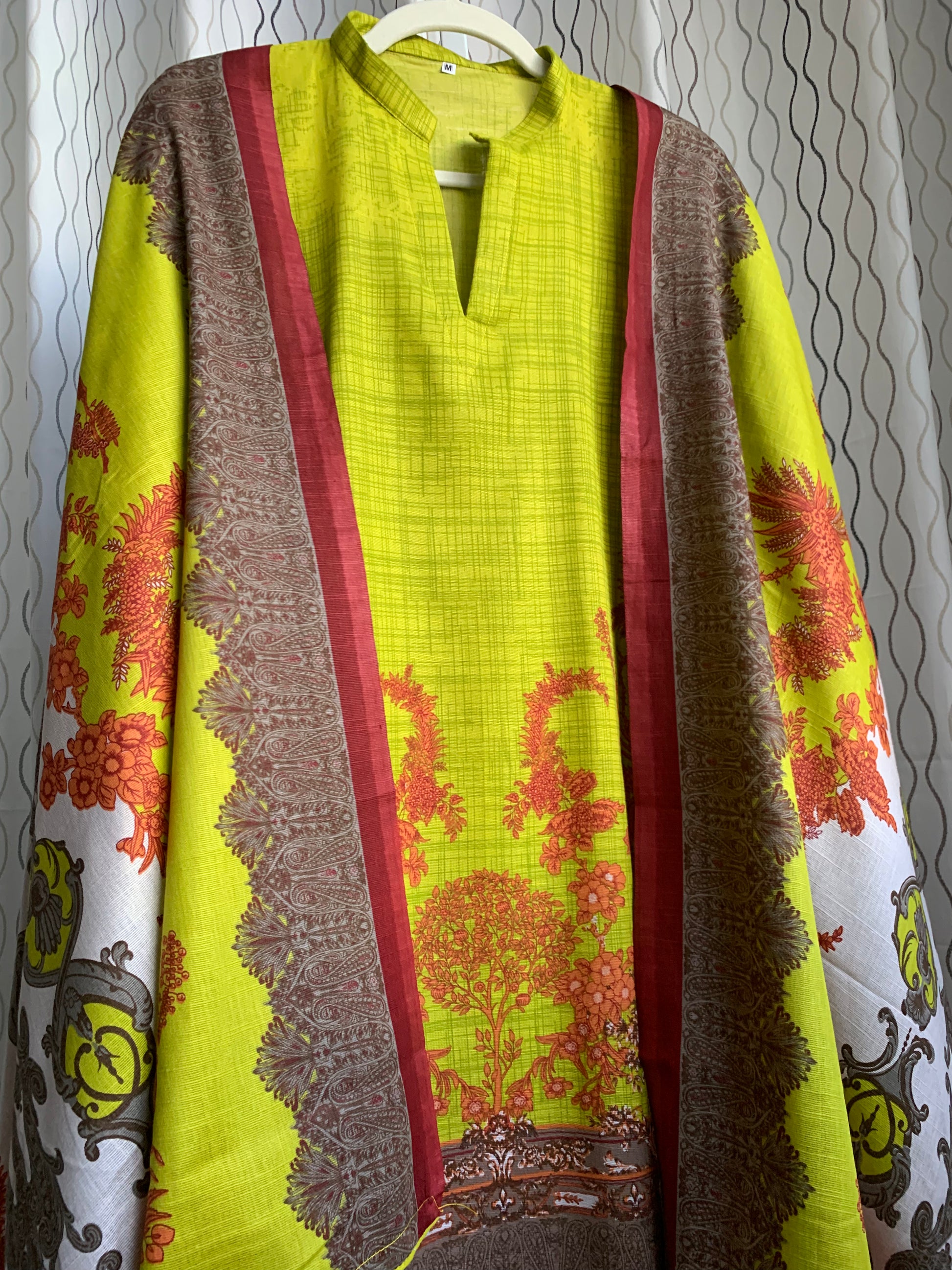 Modest Khaddar Suit for Women:  it offers a Modest Style and Custom Stitch. Crafted with Exotic Khaddar Fabric, which is a blend of Organic Cotton and Wool Slub. This 3 piece suit includes one Tunic, matching Trouser and a full Shawl, perfect for the winter season. Available in Lime Green color and S-M-L-XL  sizes, and guarantees both comfort and elegance.