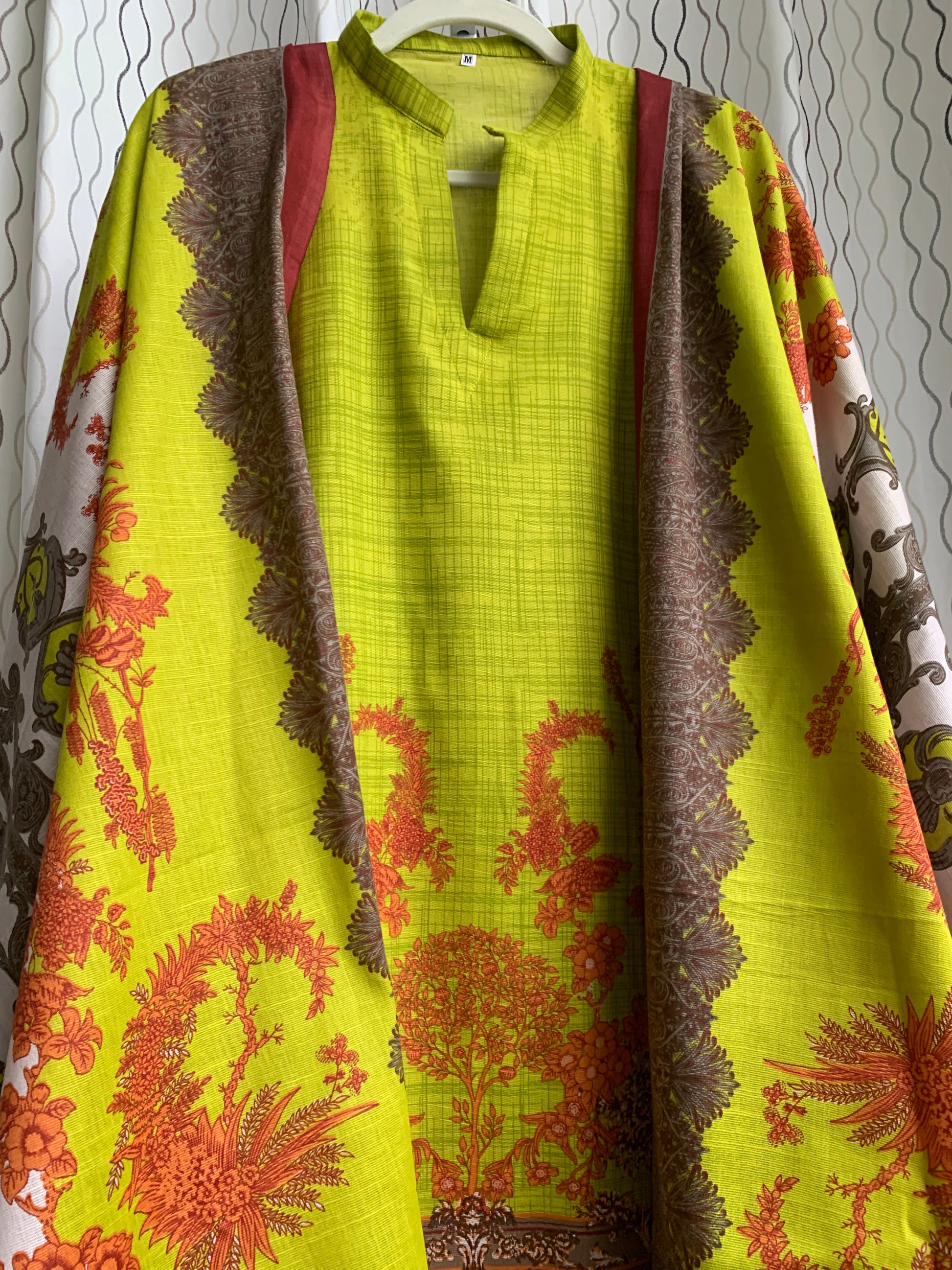 Modest Khaddar Suit for Women:  it offers a Modest Style and Custom Stitch. Crafted with Exotic Khaddar Fabric, which is a blend of Organic Cotton and Wool Slub. This 3 piece suit includes one Tunic, matching Trouser and a full Shawl, perfect for the winter season. Available in Lime Green color and S-M-L-XL  sizes, and guarantees both comfort and elegance.