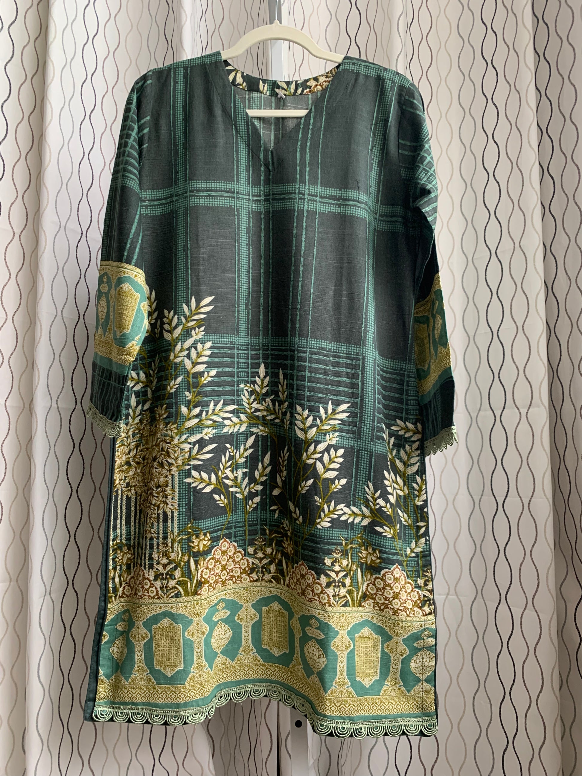 Modest Khaddar Suit for Women:  it offers a Modest Style and Custom Stitch. Crafted with Exotic Khaddar Fabric, which is a blend of Organic Cotton and Wool Slub. This 3 piece suit includes one Tunic, matching Trouser and a full Shawl, perfect for the winter season. Available in Green color and S-M-L-XL  sizes, and guarantees both comfort and elegance.