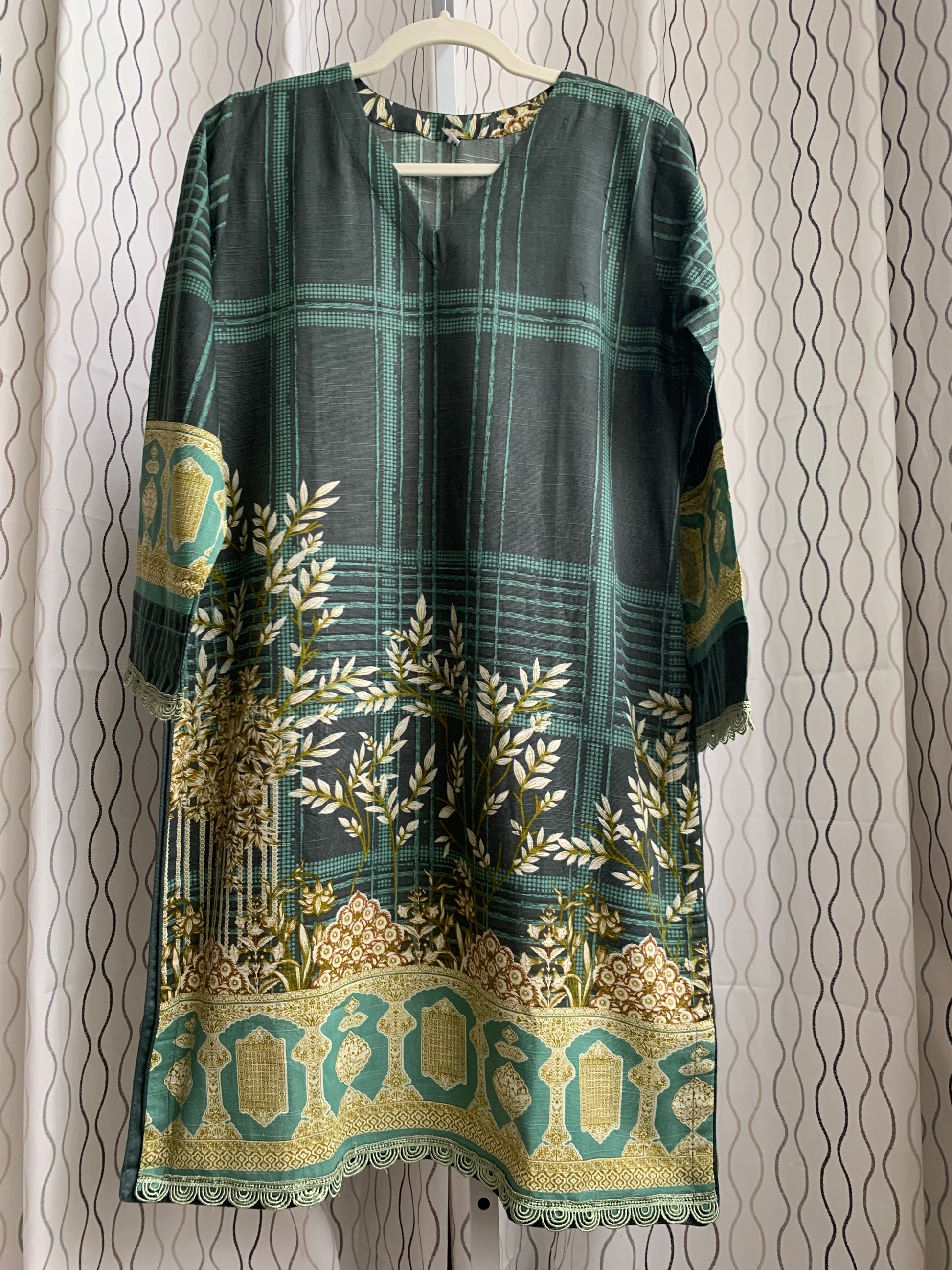 Modest Khaddar Suit for Women:  it offers a Modest Style and Custom Stitch. Crafted with Exotic Khaddar Fabric, which is a blend of Organic Cotton and Wool Slub. This 3 piece suit includes one Tunic, matching Trouser and a full Shawl, perfect for the winter season. Available in Green color and S-M-L-XL  sizes, and guarantees both comfort and elegance.