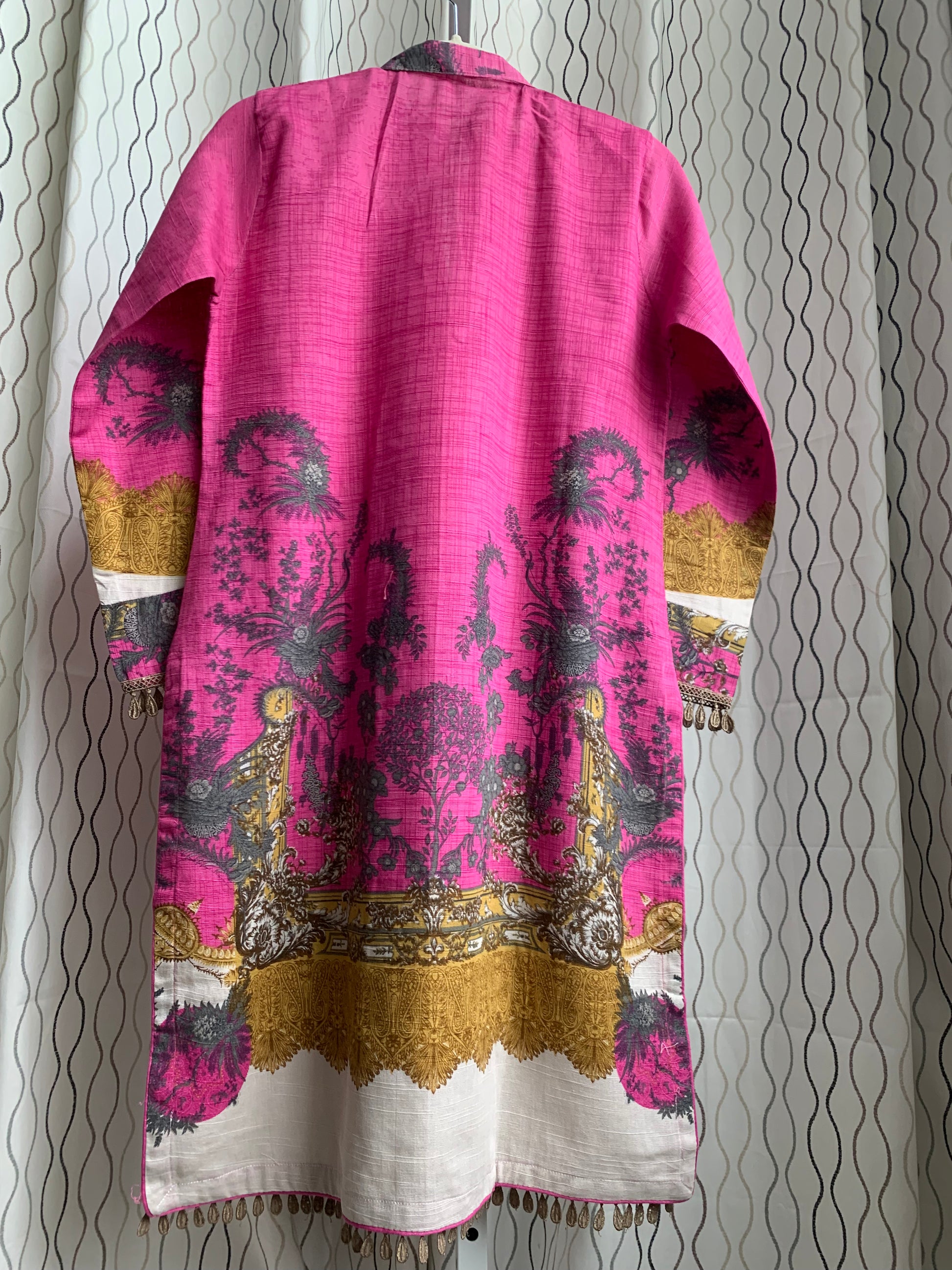 Modest Khaddar Suit for Women:  it offers a Modest Style and Custom Stitch. Crafted with Exotic Khaddar Fabric, which is a blend of Organic Cotton and Wool Slub. This 3 piece suit includes one Tunic, matching Trouser and a full Shawl, perfect for the winter season. Available in Pink color and S-M-L-XL  sizes, and guarantees both comfort and elegance.