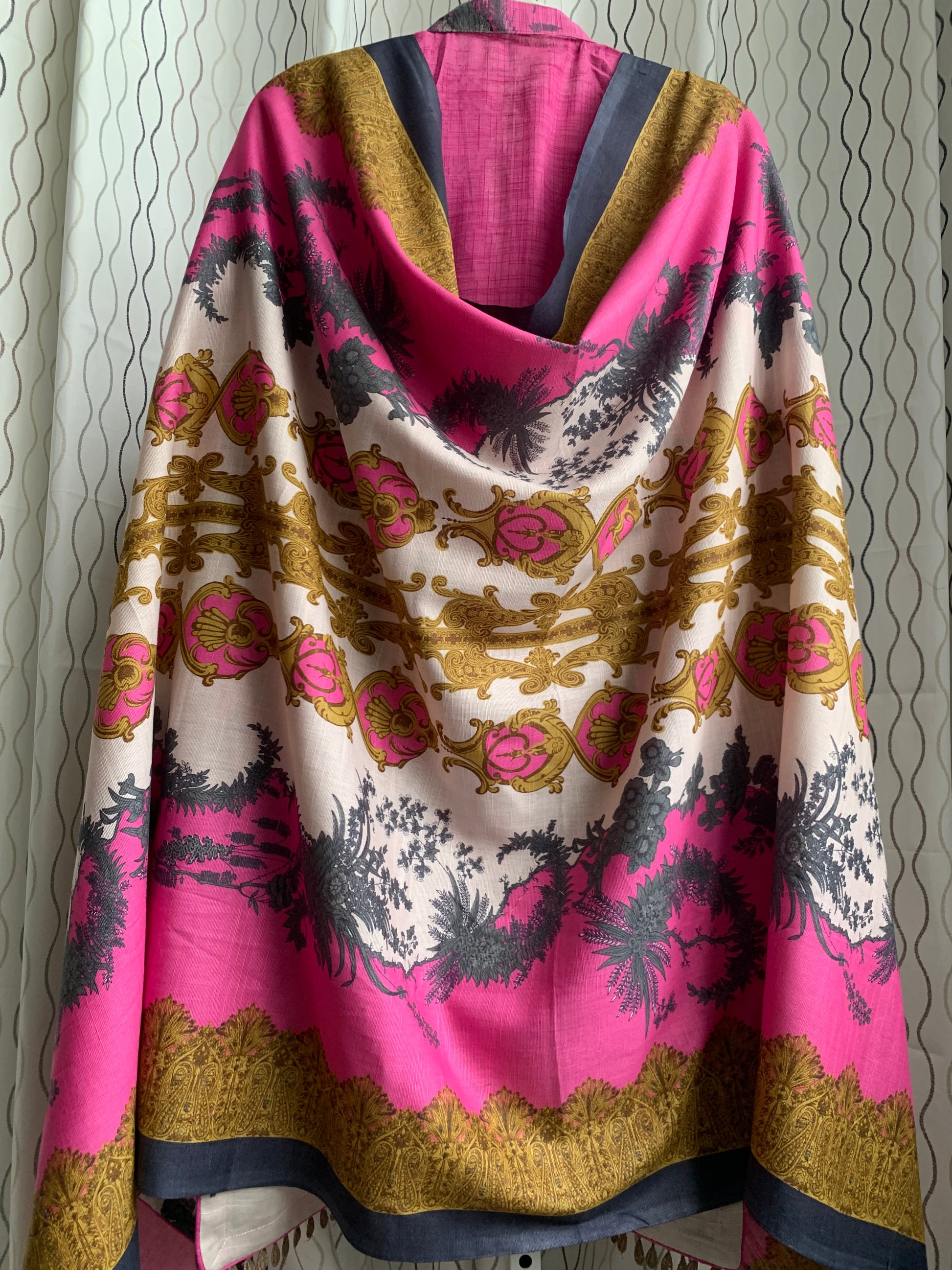 Modest Khaddar Suit for Women:  it offers a Modest Style and Custom Stitch. Crafted with Exotic Khaddar Fabric, which is a blend of Organic Cotton and Wool Slub. This 3 piece suit includes one Tunic, matching Trouser and a full Shawl, perfect for the winter season. Available in Pink color and S-M-L-XL  sizes, and guarantees both comfort and elegance.