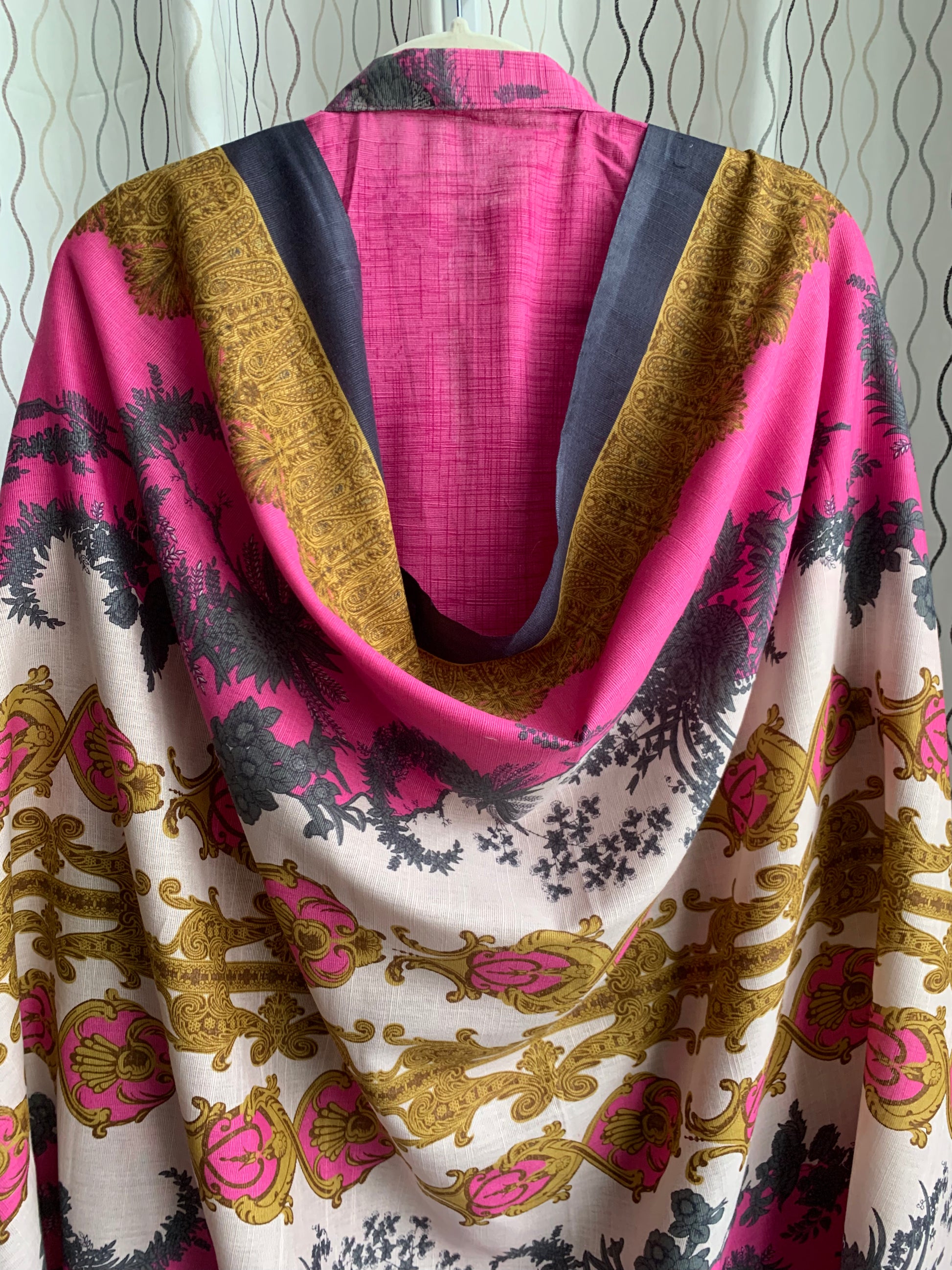 Modest Khaddar Suit for Women:  it offers a Modest Style and Custom Stitch. Crafted with Exotic Khaddar Fabric, which is a blend of Organic Cotton and Wool Slub. This 3 piece suit includes one Tunic, matching Trouser and a full Shawl, perfect for the winter season. Available in Pink color and S-M-L-XL  sizes, and guarantees both comfort and elegance.