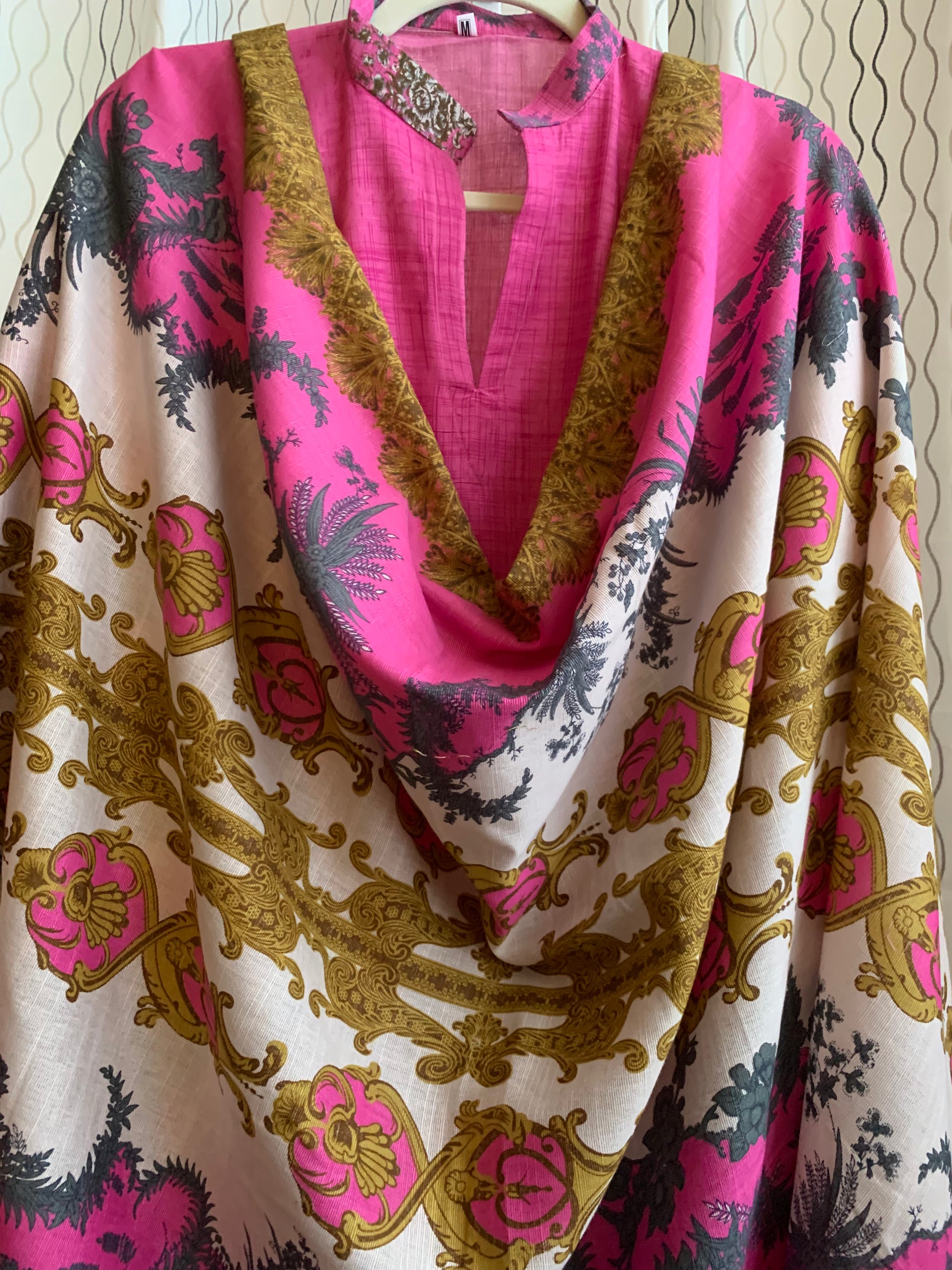 Modest Khaddar Suit for Women:  it offers a Modest Style and Custom Stitch. Crafted with Exotic Khaddar Fabric, which is a blend of Organic Cotton and Wool Slub. This 3 piece suit includes one Tunic, matching Trouser and a full Shawl, perfect for the winter season. Available in Pink color and S-M-L-XL  sizes, and guarantees both comfort and elegance.