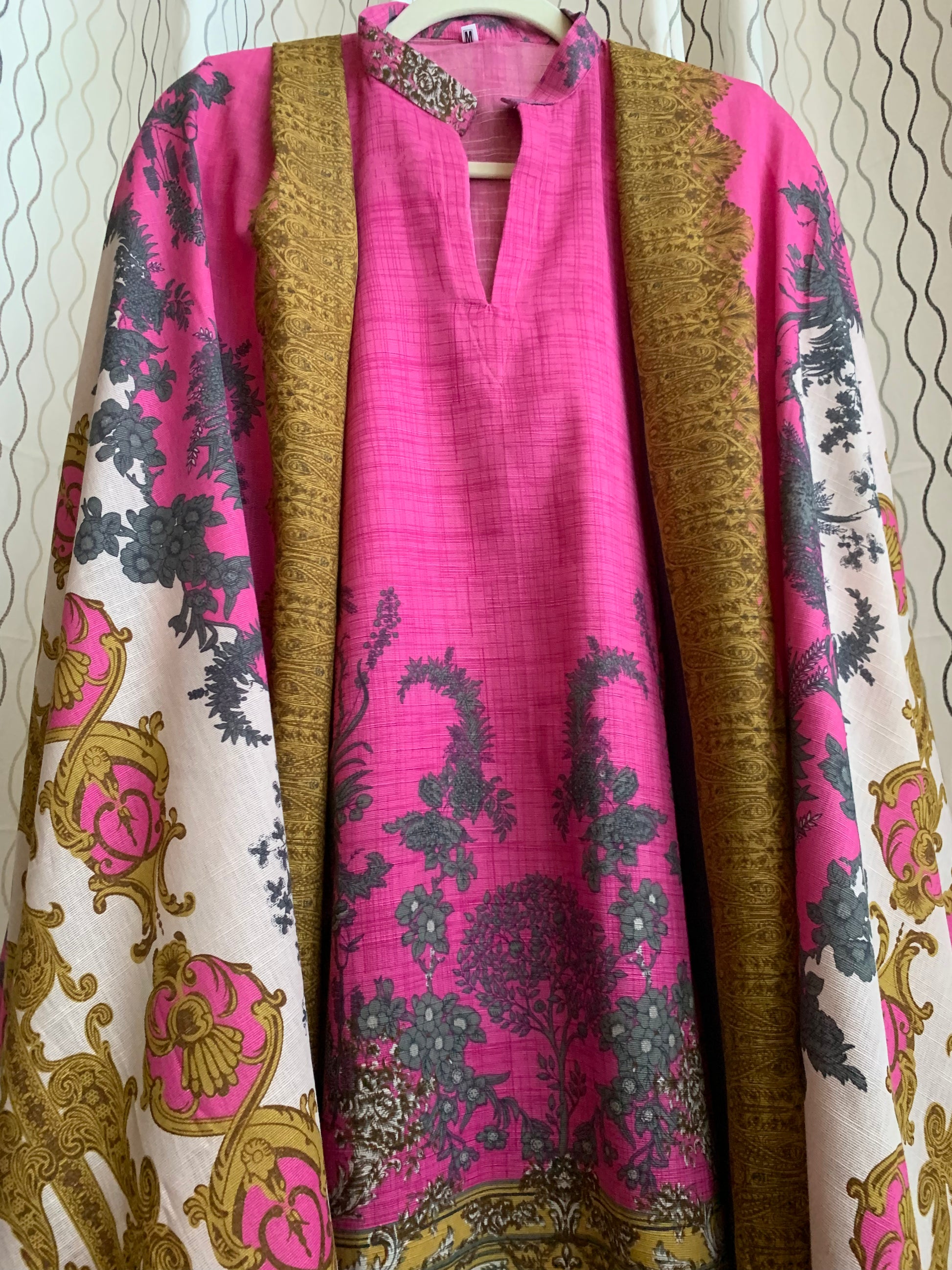 Modest Khaddar Suit for Women:  it offers a Modest Style and Custom Stitch. Crafted with Exotic Khaddar Fabric, which is a blend of Organic Cotton and Wool Slub. This 3 piece suit includes one Tunic, matching Trouser and a full Shawl, perfect for the winter season. Available in Pink color and S-M-L-XL  sizes, and guarantees both comfort and elegance.