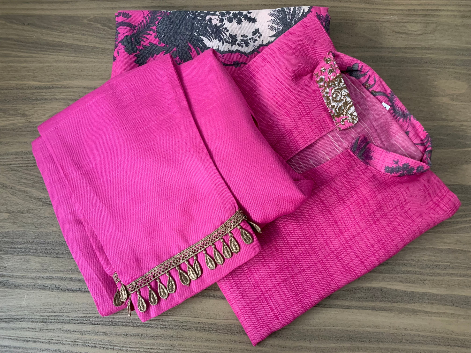 Modest Khaddar Suit for Women:  it offers a Modest Style and Custom Stitch. Crafted with Exotic Khaddar Fabric, which is a blend of Organic Cotton and Wool Slub. This 3 piece suit includes one Tunic, matching Trouser and a full Shawl, perfect for the winter season. Available in Pink color and S-M-L-XL  sizes, and guarantees both comfort and elegance.