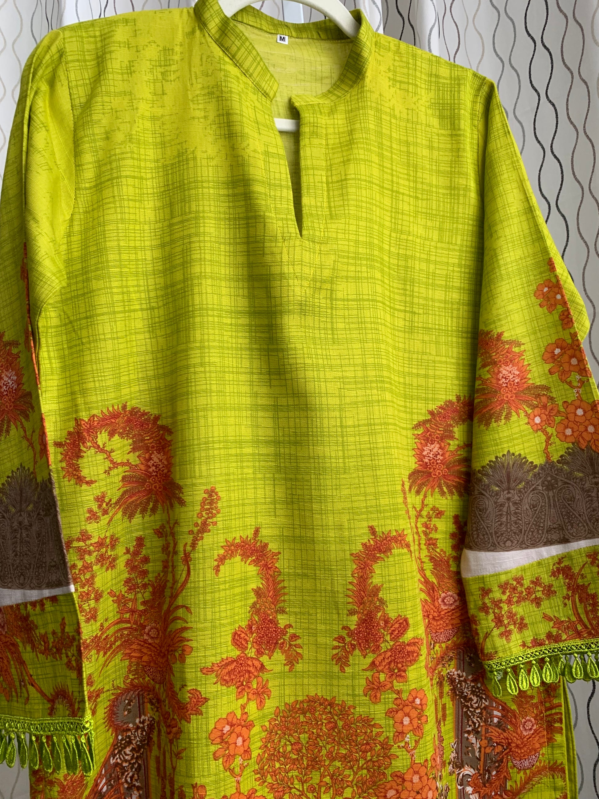 Modest Khaddar Suit for Women:  it offers a Modest Style and Custom Stitch. Crafted with Exotic Khaddar Fabric, which is a blend of Organic Cotton and Wool Slub. This 3 piece suit includes one Tunic, matching Trouser and a full Shawl, perfect for the winter season. Available in Lime Green color and S-M-L-XL  sizes, and guarantees both comfort and elegance.