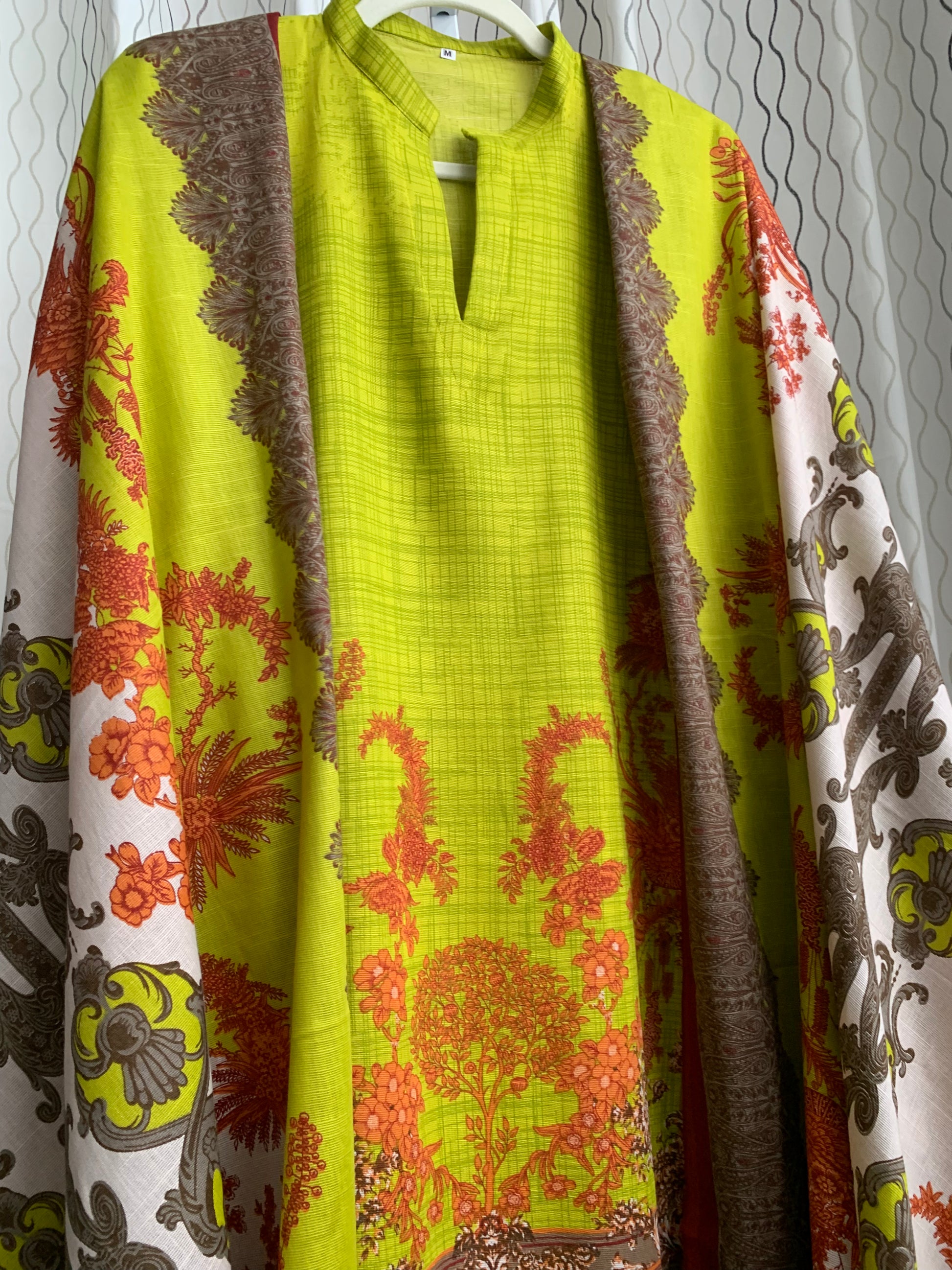 Modest Khaddar Suit for Women:  it offers a Modest Style and Custom Stitch. Crafted with Exotic Khaddar Fabric, which is a blend of Organic Cotton and Wool Slub. This 3 piece suit includes one Tunic, matching Trouser and a full Shawl, perfect for the winter season. Available in Lime Green color and S-M-L-XL  sizes, and guarantees both comfort and elegance.