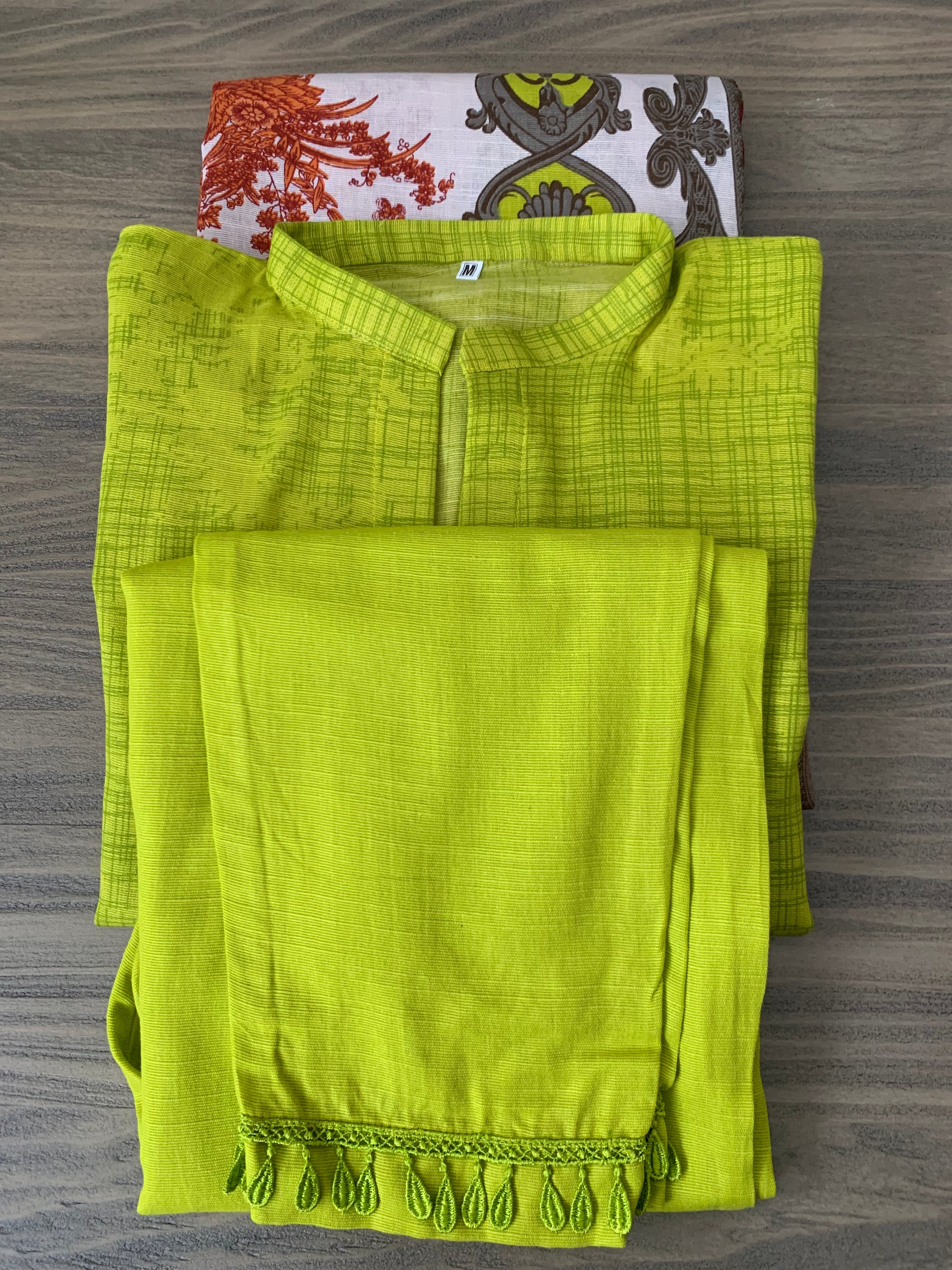 Modest Khaddar Suit for Women:  it offers a Modest Style and Custom Stitch. Crafted with Exotic Khaddar Fabric, which is a blend of Organic Cotton and Wool Slub. This 3 piece suit includes one Tunic, matching Trouser and a full Shawl, perfect for the winter season. Available in Lime Green color and S-M-L-XL  sizes, and guarantees both comfort and elegance.