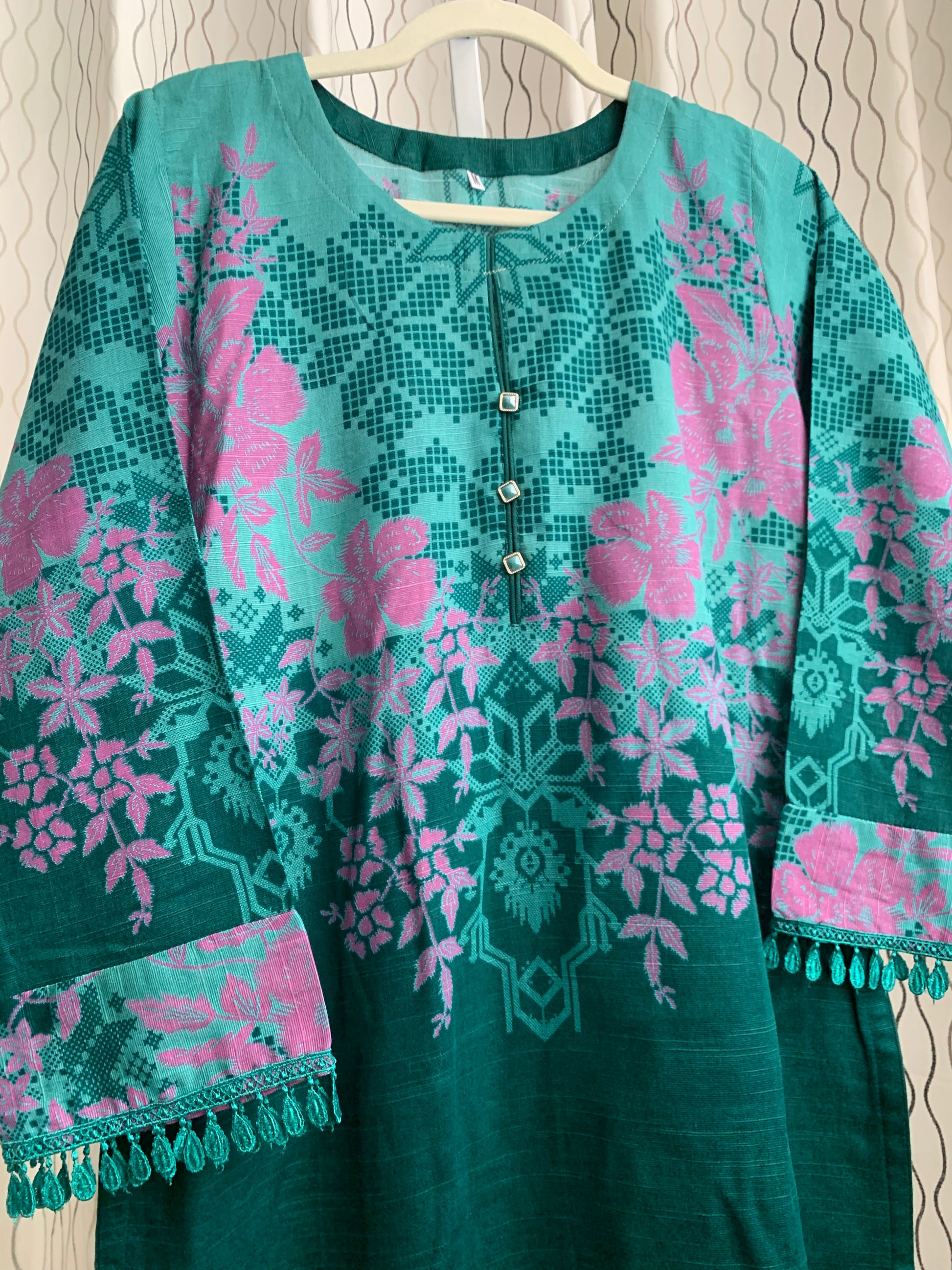 Modest Khaddar Suit for Women:  it offers a Modest Relax Fit Style along with Custom Stitch. Crafted with Exotic Khaddar Fabric, which is a blend of Organic Cotton and Wool Slub. This 3 piece suit includes one Tunic, matching Trouser and a full Shawl, perfect for the winter season. Available in Green color and S-M-L-XL  sizes, and guarantees both comfort and elegance.