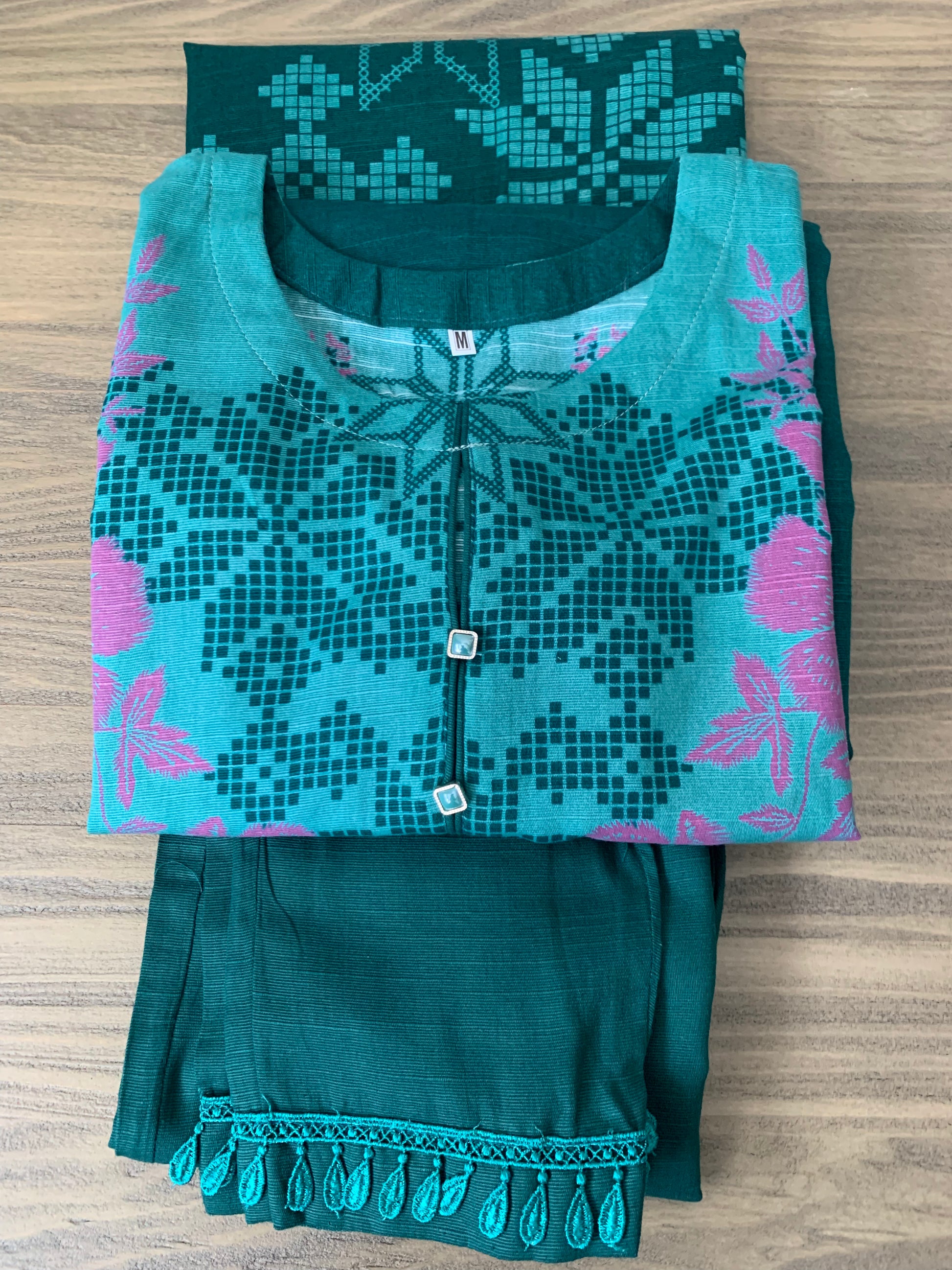 Modest Khaddar Suit for Women:  it offers a Modest Relax Fit Style along with Custom Stitch. Crafted with Exotic Khaddar Fabric, which is a blend of Organic Cotton and Wool Slub. This 3 piece suit includes one Tunic, matching Trouser and a full Shawl, perfect for the winter season. Available in Green color and S-M-L-XL  sizes, and guarantees both comfort and elegance.