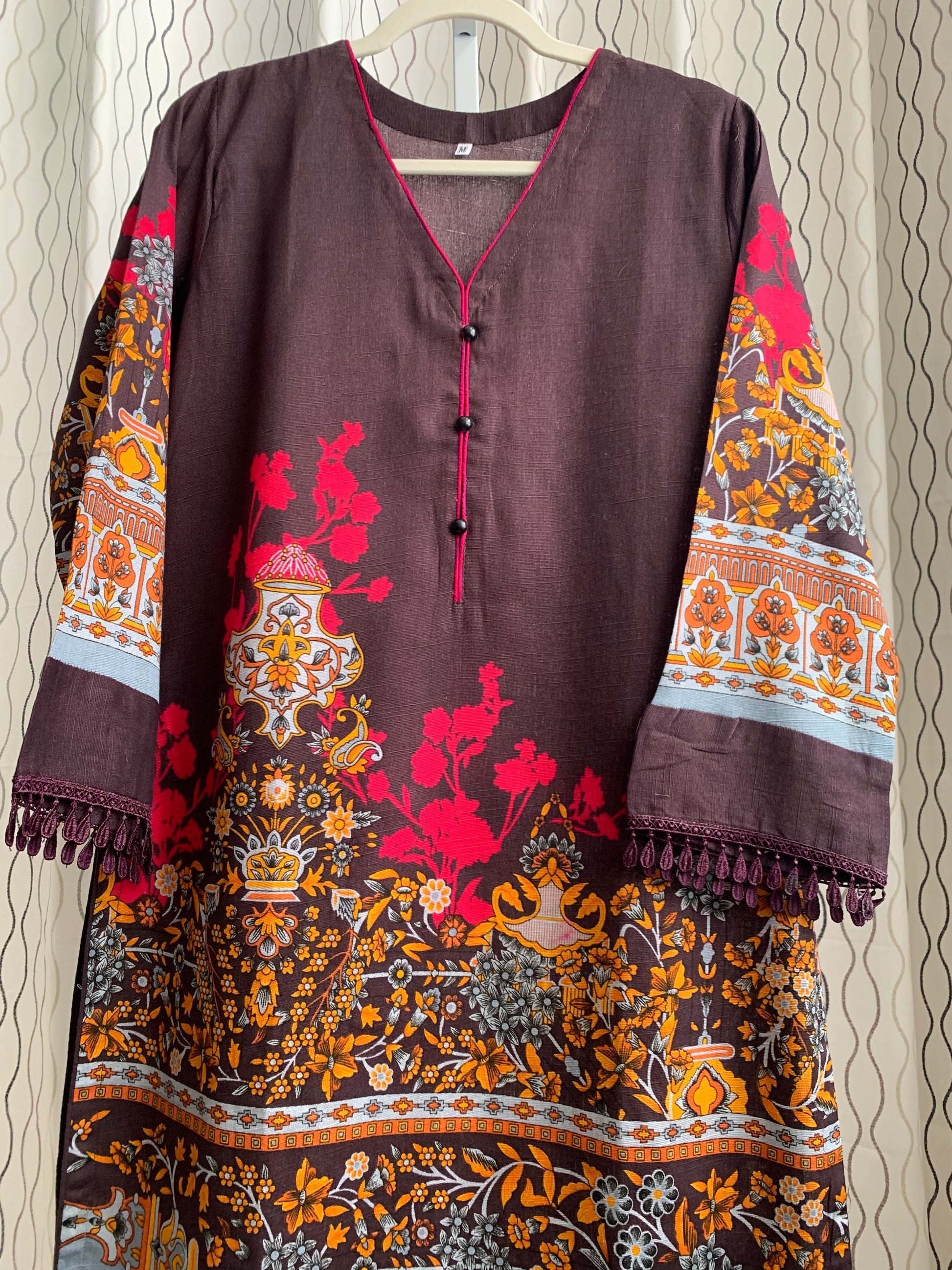 Modest Khaddar Suit for Women:  it offers a Modest Relax Fit Style along with Custom Stitch. Crafted with Exotic Khaddar Fabric, which is a blend of Organic Cotton and Wool Slub. This 3 piece suit includes one Tunic, matching Trouser and a full Shawl, perfect for the winter season. Available in Dark Brown color and S-M-L-XL  sizes, and guarantees both comfort and elegance.