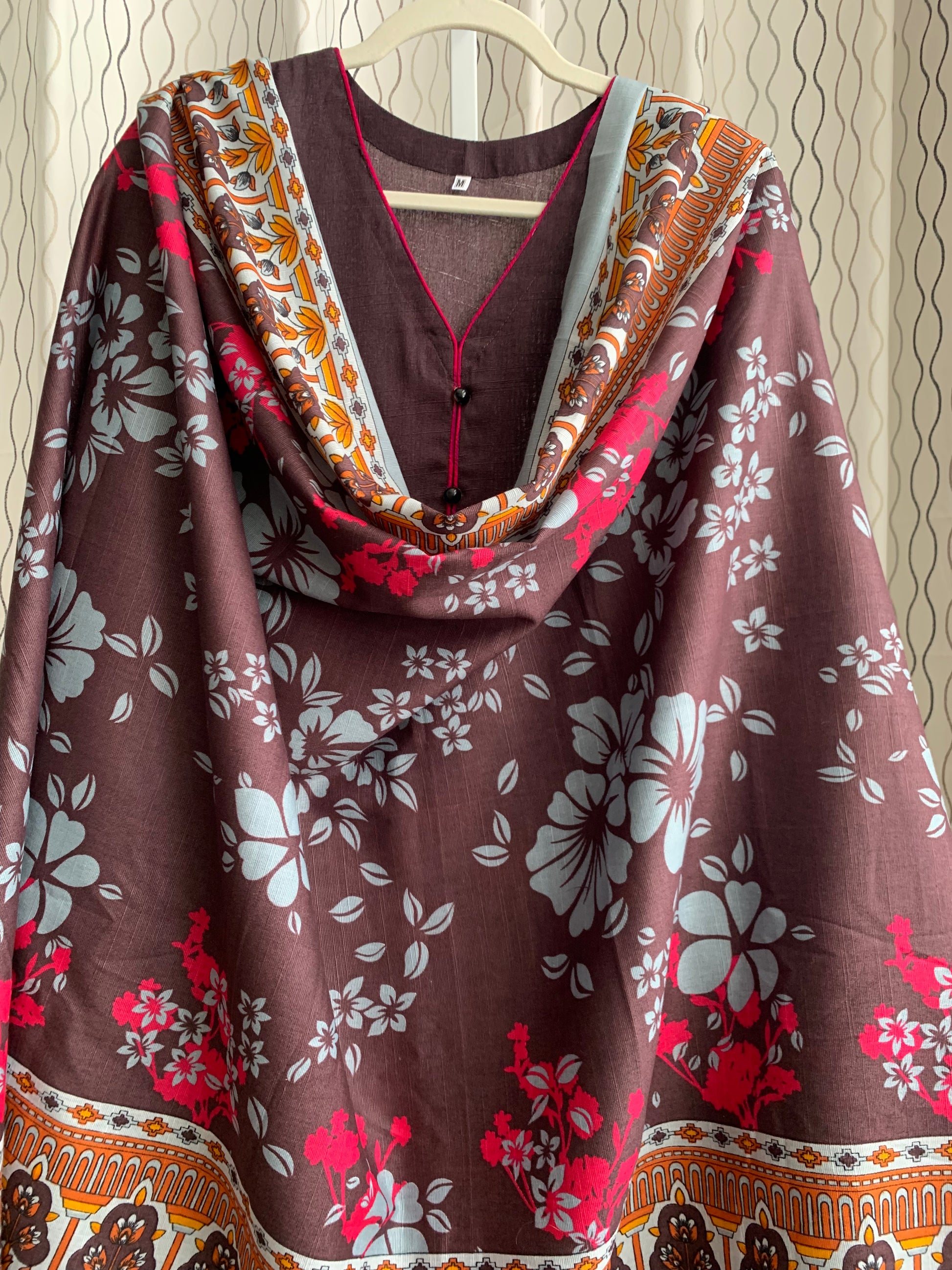 Modest Khaddar Suit for Women:  it offers a Modest Relax Fit Style along with Custom Stitch. Crafted with Exotic Khaddar Fabric, which is a blend of Organic Cotton and Wool Slub. This 3 piece suit includes one Tunic, matching Trouser and a full Shawl, perfect for the winter season. Available in Dark Brown color and S-M-L-XL  sizes, and guarantees both comfort and elegance.