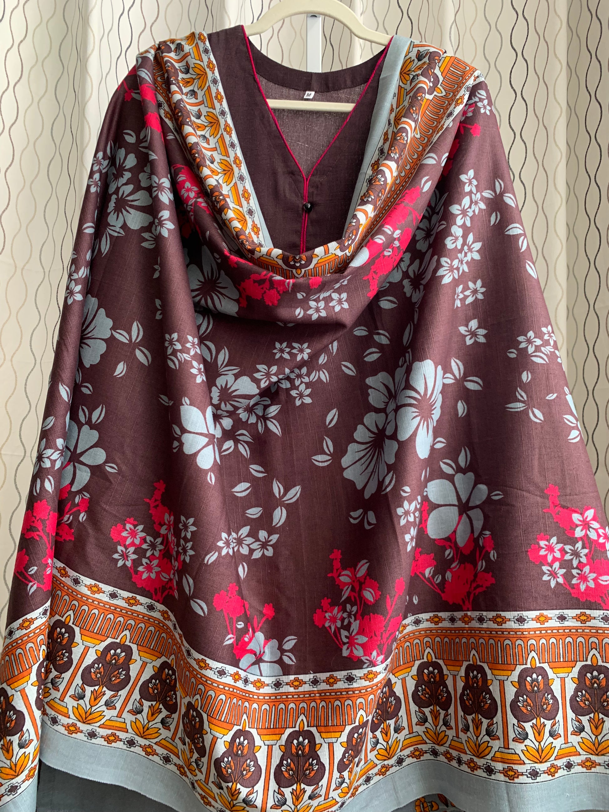Modest Khaddar Suit for Women:  it offers a Modest Relax Fit Style along with Custom Stitch. Crafted with Exotic Khaddar Fabric, which is a blend of Organic Cotton and Wool Slub. This 3 piece suit includes one Tunic, matching Trouser and a full Shawl, perfect for the winter season. Available in Dark Brown color and S-M-L-XL  sizes, and guarantees both comfort and elegance.