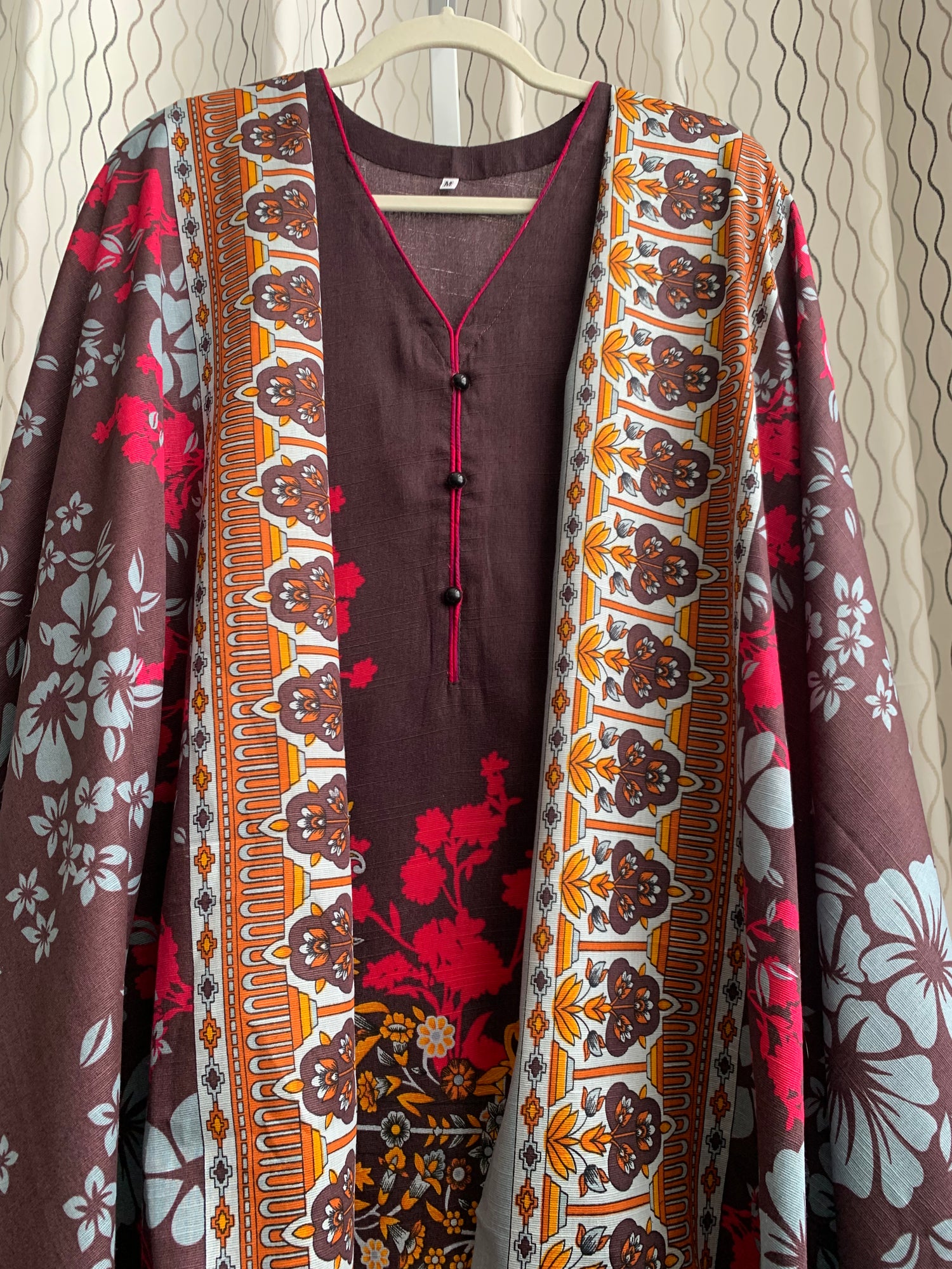 Modest Khaddar Suit for Women:  it offers a Modest Relax Fit Style along with Custom Stitch. Crafted with Exotic Khaddar Fabric, which is a blend of Organic Cotton and Wool Slub. This 3 piece suit includes one Tunic, matching Trouser and a full Shawl, perfect for the winter season. Available in Dark Brown color and S-M-L-XL  sizes, and guarantees both comfort and elegance.