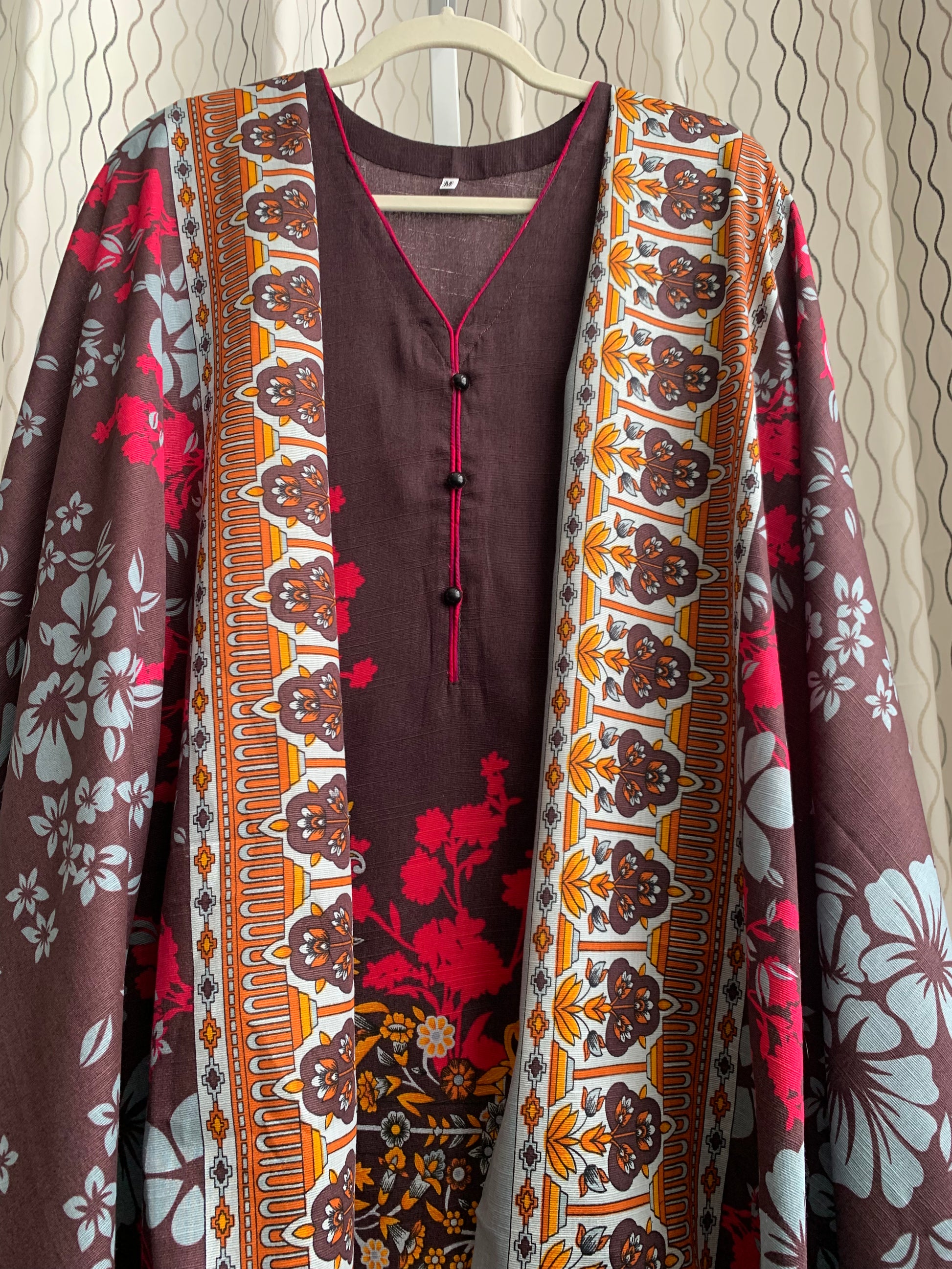 Modest Khaddar Suit for Women:  it offers a Modest Relax Fit Style along with Custom Stitch. Crafted with Exotic Khaddar Fabric, which is a blend of Organic Cotton and Wool Slub. This 3 piece suit includes one Tunic, matching Trouser and a full Shawl, perfect for the winter season. Available in Dark Brown color and S-M-L-XL  sizes, and guarantees both comfort and elegance.