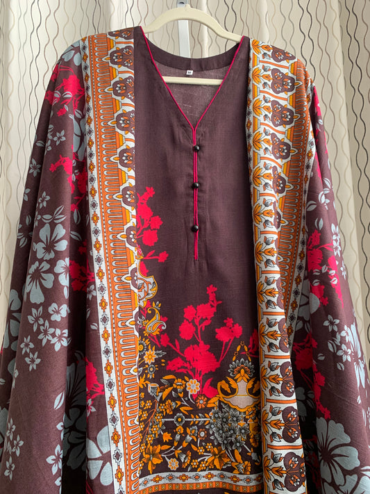 Modest Khaddar Suit for Women:  it offers a Modest Relax Fit Style along with Custom Stitch. Crafted with Exotic Khaddar Fabric, which is a blend of Organic Cotton and Wool Slub. This 3 piece suit includes one Tunic, matching Trouser and a full Shawl, perfect for the winter season. Available in Dark Brown color and S-M-L-XL  sizes, and guarantees both comfort and elegance.