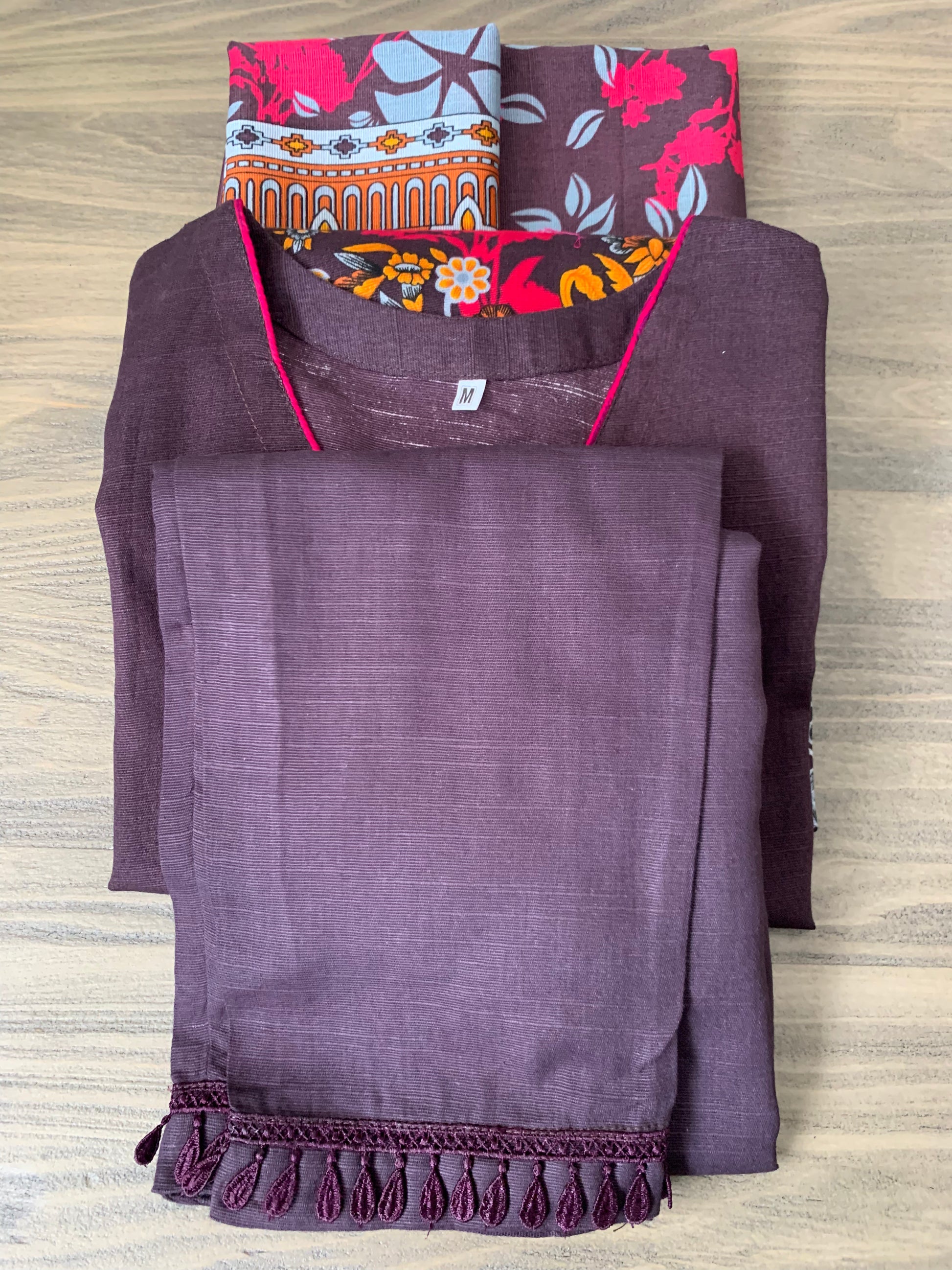 Modest Khaddar Suit for Women:  it offers a Modest Relax Fit Style along with Custom Stitch. Crafted with Exotic Khaddar Fabric, which is a blend of Organic Cotton and Wool Slub. This 3 piece suit includes one Tunic, matching Trouser and a full Shawl, perfect for the winter season. Available in Dark Brown color and S-M-L-XL  sizes, and guarantees both comfort and elegance.