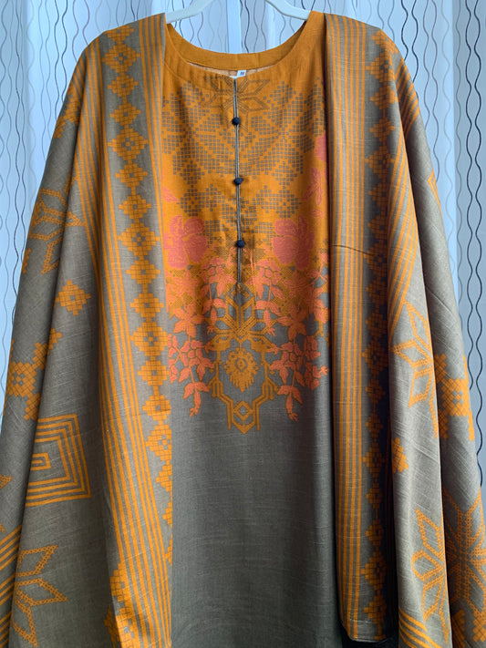 Modest Khaddar Suit for Women:  it offers a Modest Relax Fit Style along with Custom Stitch. Crafted with Exotic Khaddar Fabric, which is a blend of Organic Cotton and Wool Slub. This 3 piece suit includes one Tunic, matching Trouser and a full Shawl, perfect for the winter season. Available in Bronze & Green color, S-M-L-XL  sizes, and guarantees both comfort and elegance.