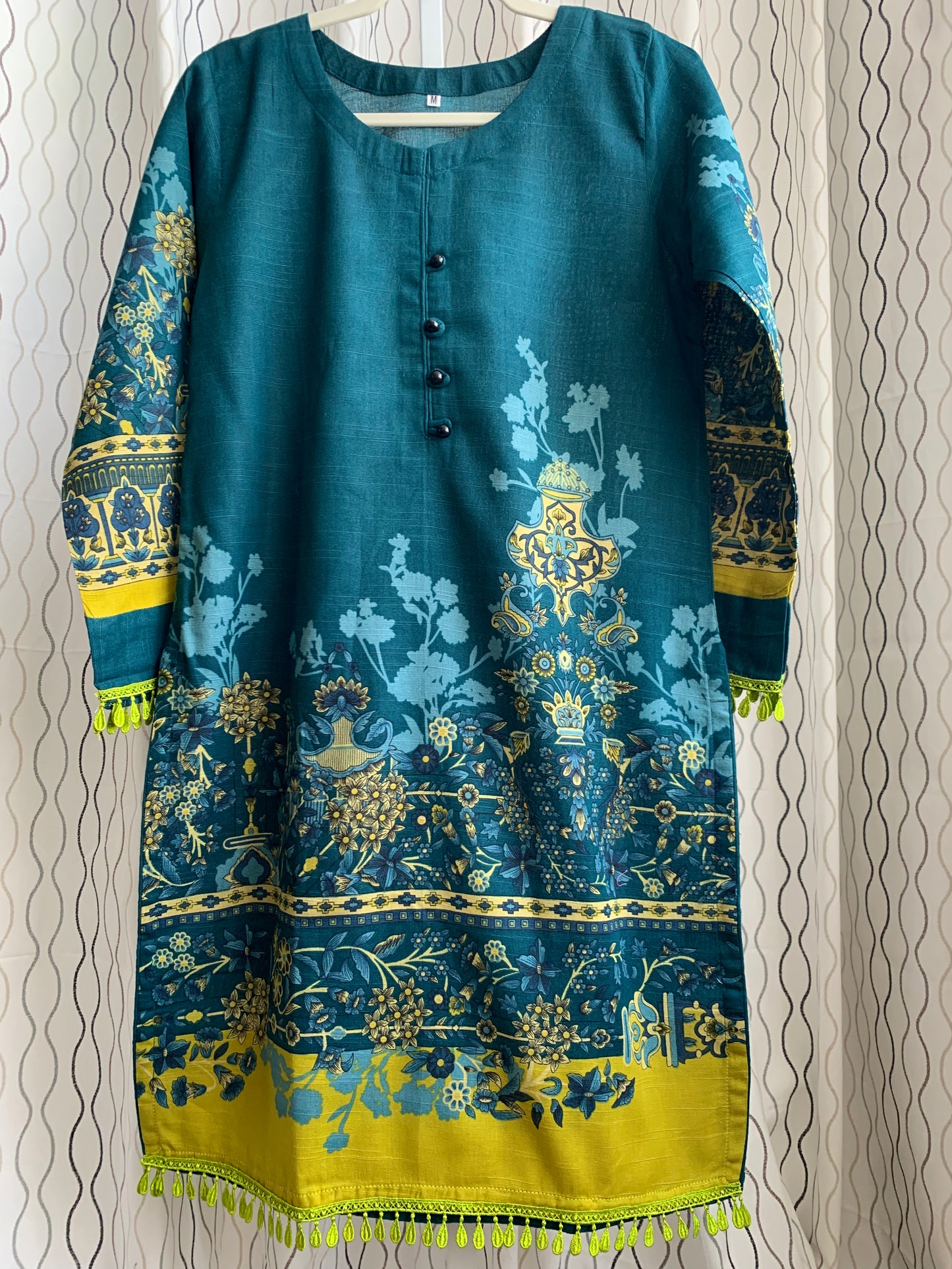 Modest Khaddar Suit for Women: it offers a Modest Relax Fit Style along with Custom Stitch. Crafted with Exotic Khaddar Fabric, which is a blend of Organic Cotton and Wool Slub. This 3 piece suit includes one Tunic, matching Trouser and a full Shawl, perfect for the winter season. Available in Dark Green color and S-M-L-XL sizes, and guarantees both comfort and elegance.