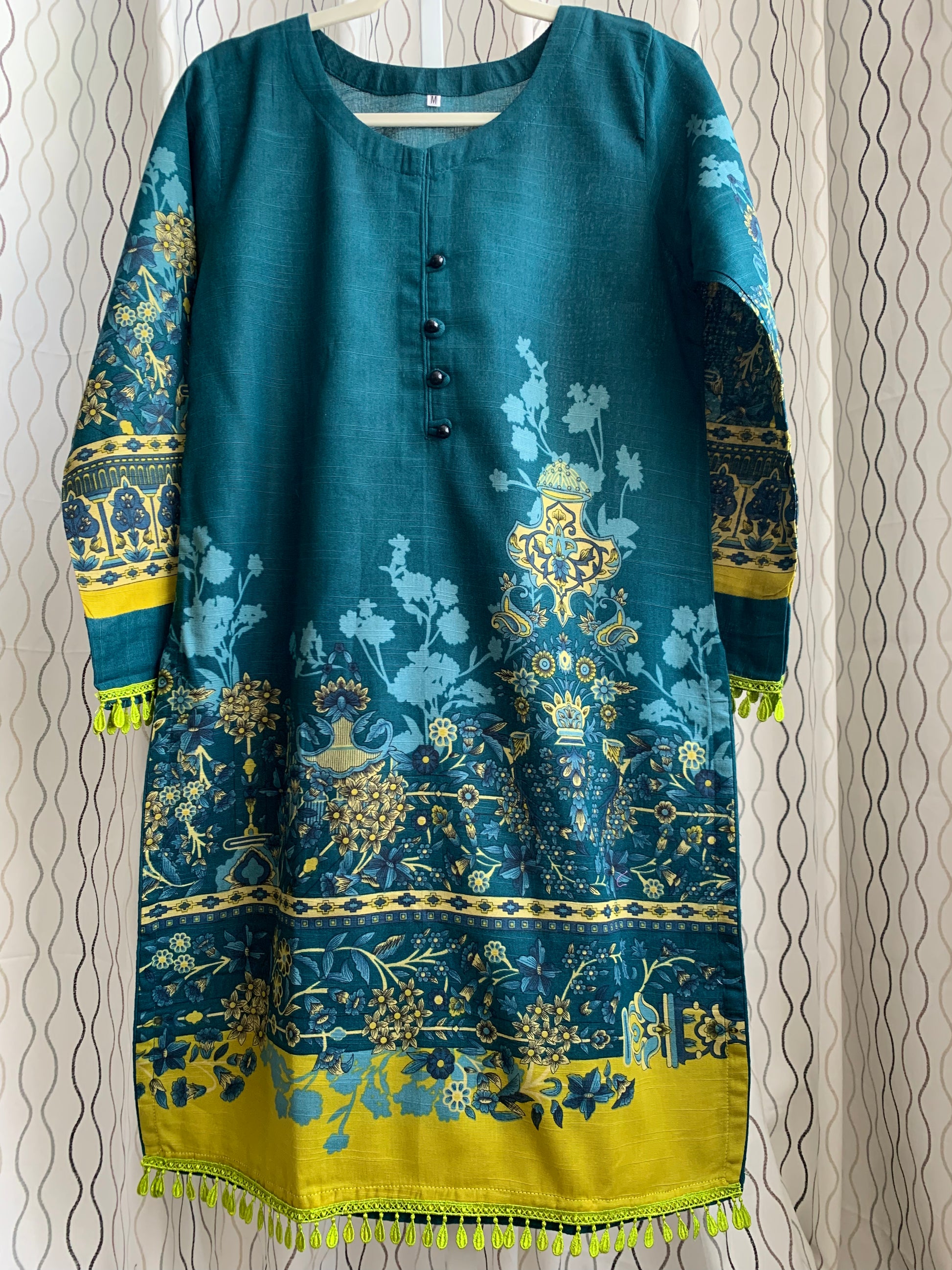 Modest Khaddar Suit for Women:  it offers a Modest Relax Fit Style along with Custom Stitch. Crafted with Exotic Khaddar Fabric, which is a blend of Organic Cotton and Wool Slub. This 3 piece suit includes one Tunic, matching Trouser and a full Shawl, perfect for the winter season. Available in Dark Green color and S-M-L-XL  sizes, and guarantees both comfort and elegance.