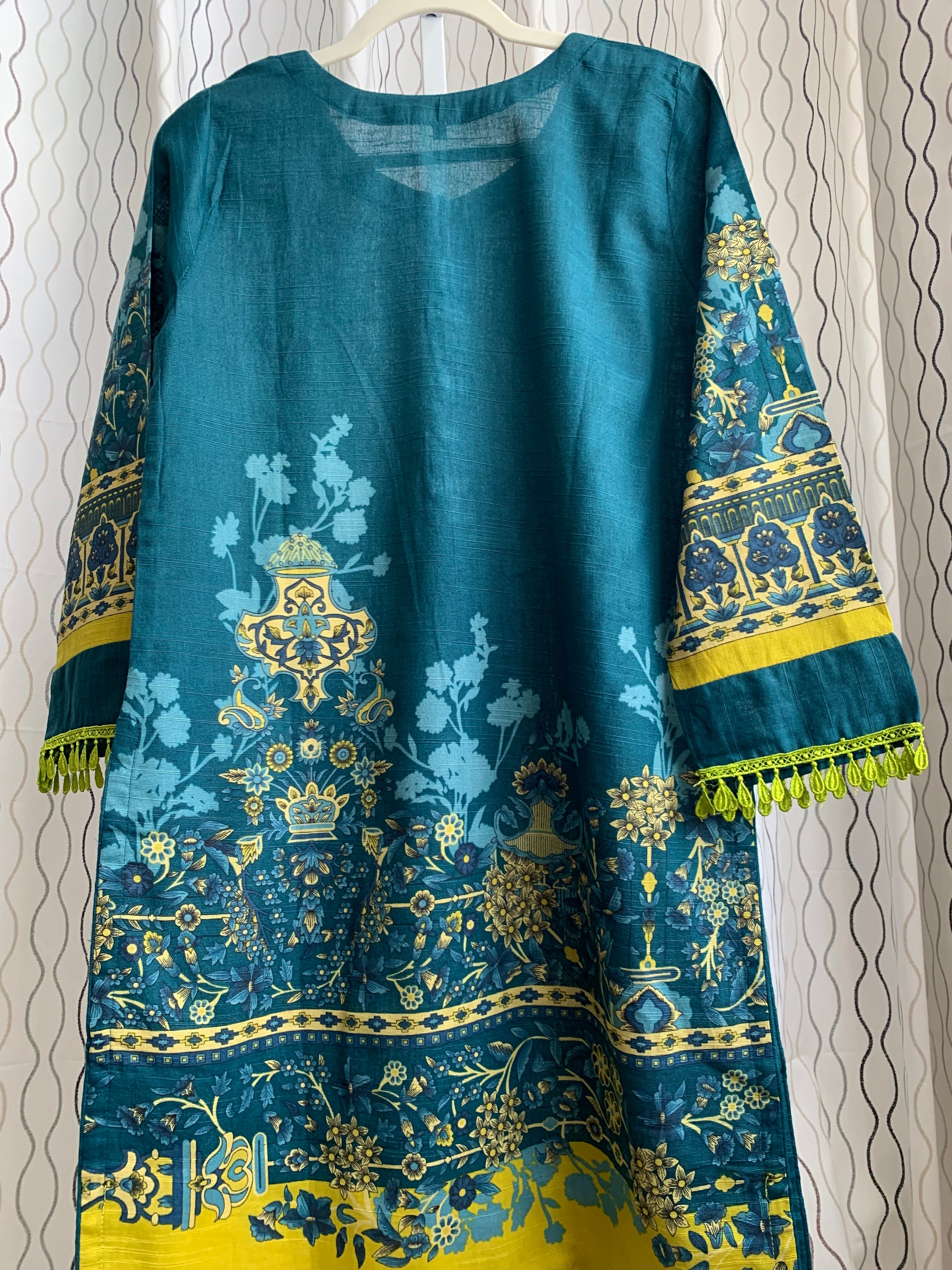Modest Khaddar Suit for Women:  it offers a Modest Relax Fit Style along with Custom Stitch. Crafted with Exotic Khaddar Fabric, which is a blend of Organic Cotton and Wool Slub. This 3 piece suit includes one Tunic, matching Trouser and a full Shawl, perfect for the winter season. Available in Dark Green color and S-M-L-XL  sizes, and guarantees both comfort and elegance.