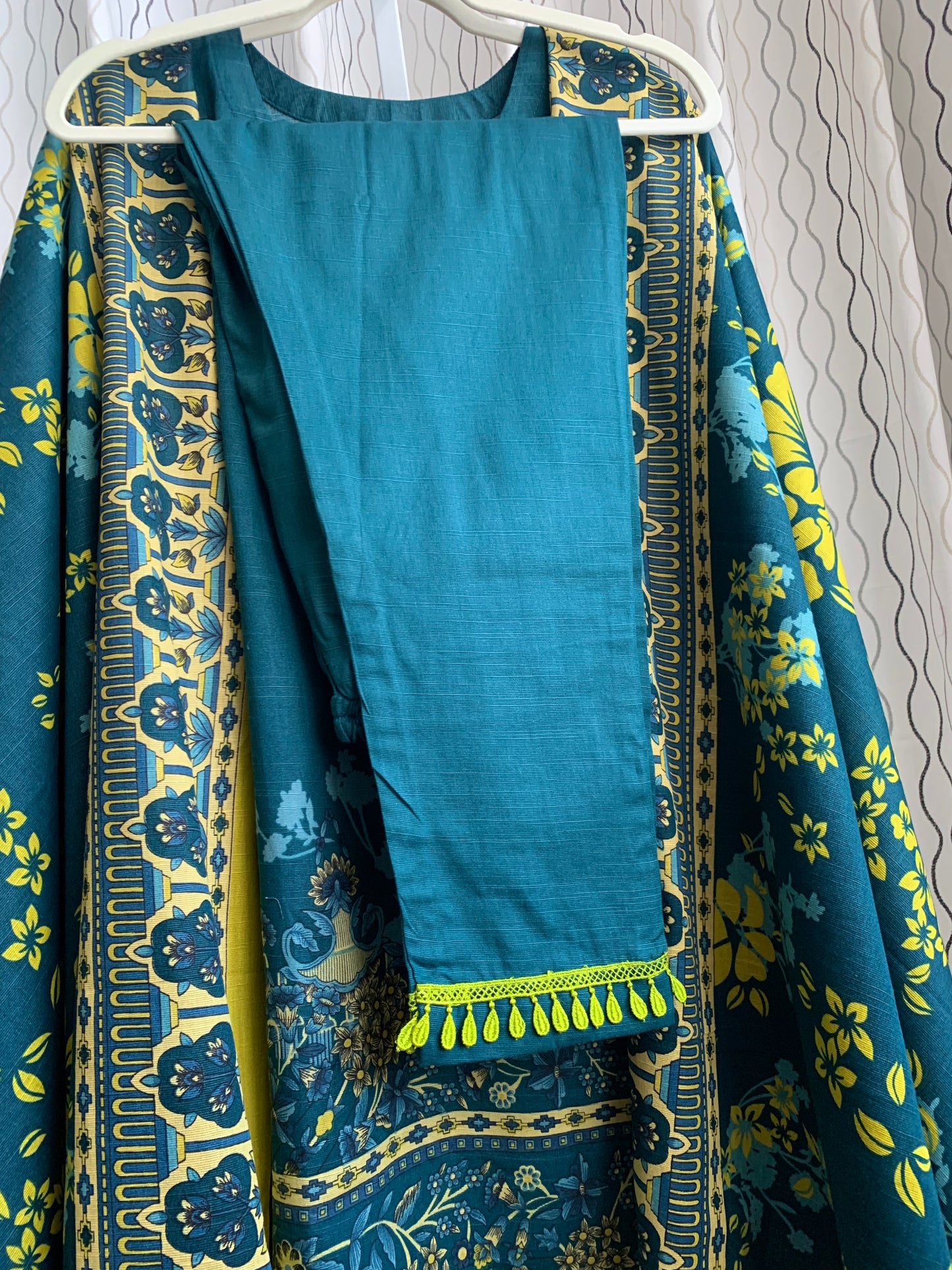 Modest Khaddar Suit for Women: it offers a Modest Relax Fit Style along with Custom Stitch. Crafted with Exotic Khaddar Fabric, which is a blend of Organic Cotton and Wool Slub. This 3 piece suit includes one Tunic, matching Trouser and a full Shawl, perfect for the winter season. Available in Dark Green color and S-M-L-XL sizes, and guarantees both comfort and elegance.