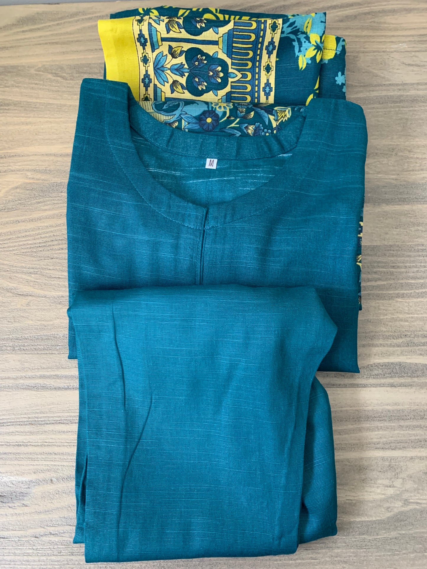 Modest Khaddar Suit for Women: it offers a Modest Relax Fit Style along with Custom Stitch. Crafted with Exotic Khaddar Fabric, which is a blend of Organic Cotton and Wool Slub. This 3 piece suit includes one Tunic, matching Trouser and a full Shawl, perfect for the winter season. Available in Dark Green color and S-M-L-XL sizes, and guarantees both comfort and elegance.