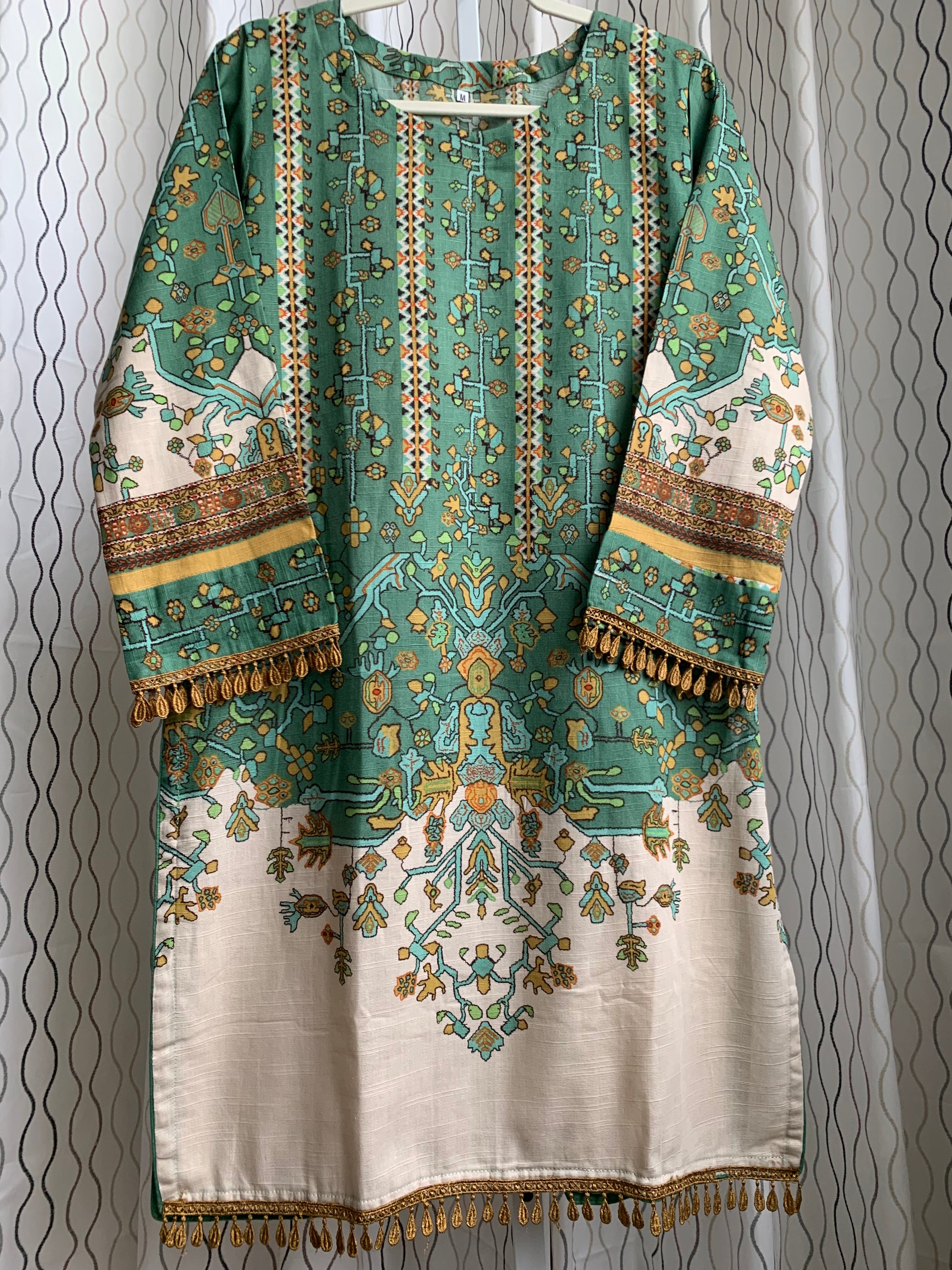 Modest Khaddar Suit for Women: it offers a Modest Relax Fit Style along with Custom Stitch. Crafted with Exotic Khaddar Fabric, which is a blend of Organic Cotton and Wool Slub. This 3 piece suit includes one Tunic, matching Trouser and a full Shawl, perfect for the winter season. Available in Sage Green color with S-M-L-XL sizes, and it guarantees both comfort and elegance.