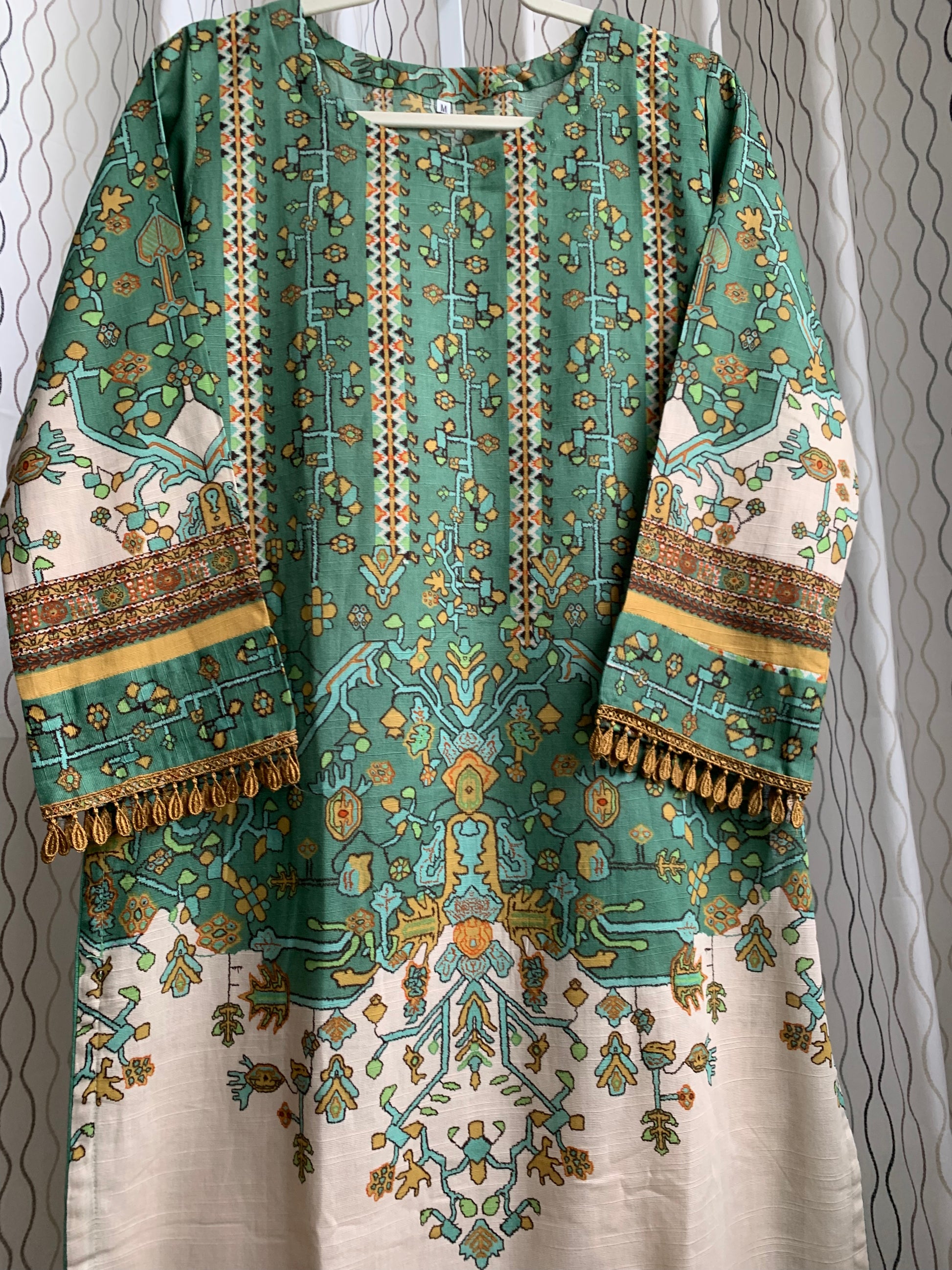 Modest Khaddar Suit for Women: it offers a Modest Relax Fit Style along with Custom Stitch. Crafted with Exotic Khaddar Fabric, which is a blend of Organic Cotton and Wool Slub. This 3 piece suit includes one Tunic, matching Trouser and a full Shawl, perfect for the winter season. Available in Sage Green color with S-M-L-XL sizes, and it guarantees both comfort and elegance.