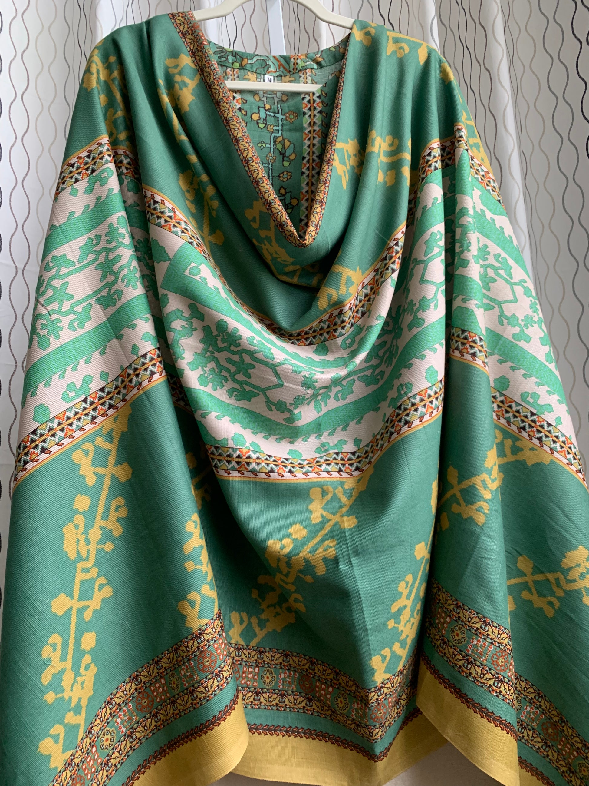 Modest Khaddar Suit for Women: it offers a Modest Relax Fit Style along with Custom Stitch. Crafted with Exotic Khaddar Fabric, which is a blend of Organic Cotton and Wool Slub. This 3 piece suit includes one Tunic, matching Trouser and a full Shawl, perfect for the winter season. Available in Sage Green color with S-M-L-XL sizes, and it guarantees both comfort and elegance.