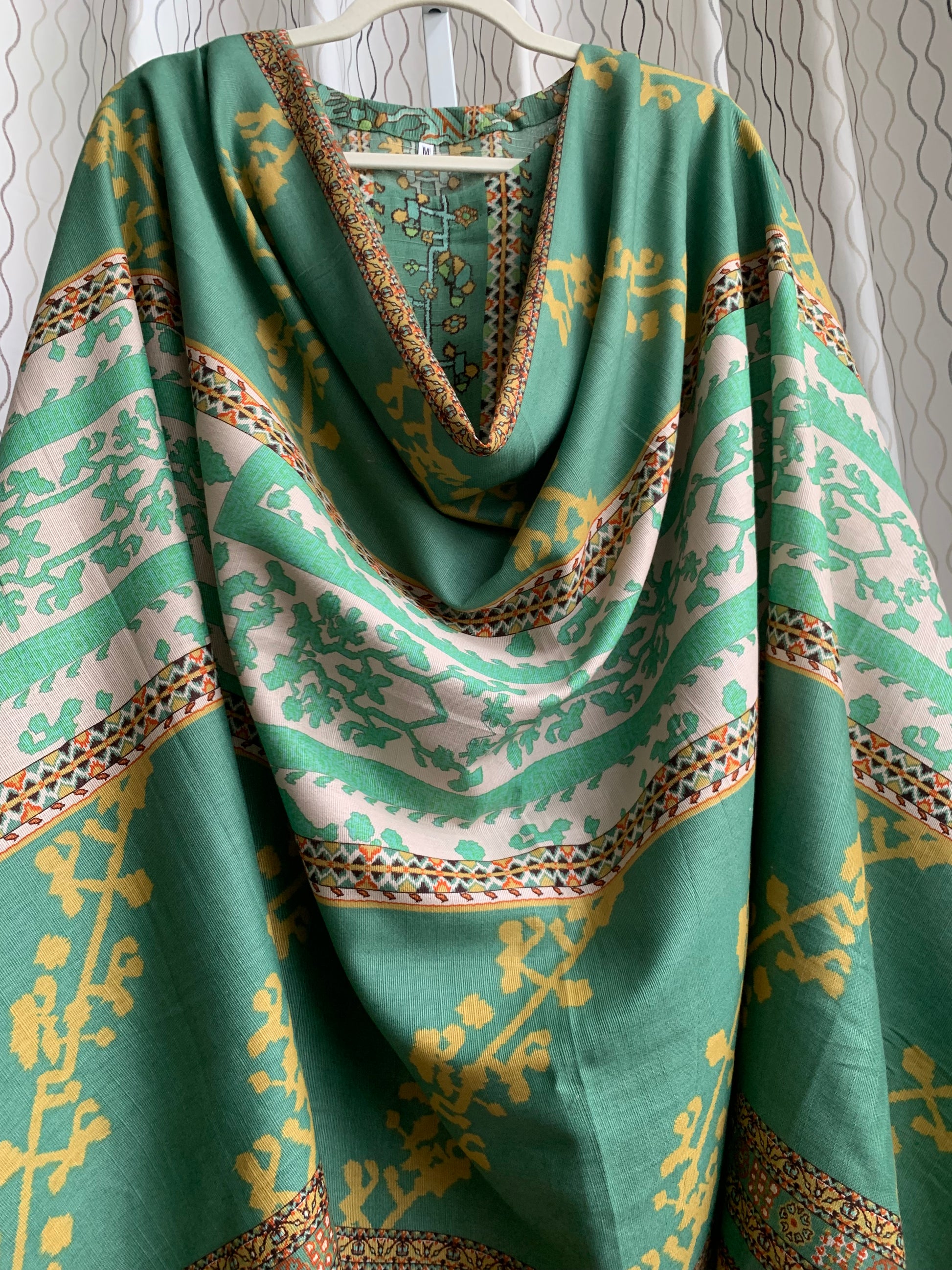Modest Khaddar Suit for Women: it offers a Modest Relax Fit Style along with Custom Stitch. Crafted with Exotic Khaddar Fabric, which is a blend of Organic Cotton and Wool Slub. This 3 piece suit includes one Tunic, matching Trouser and a full Shawl, perfect for the winter season. Available in Sage Green color with S-M-L-XL sizes, and it guarantees both comfort and elegance.