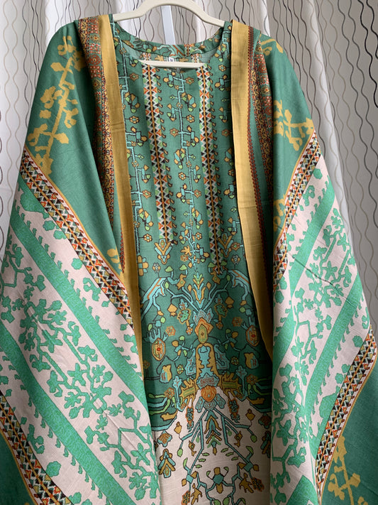 Modest Khaddar Suit for Women: it offers a Modest Relax Fit Style along with Custom Stitch. Crafted with Exotic Khaddar Fabric, which is a blend of Organic Cotton and Wool Slub. This 3 piece suit includes one Tunic, matching Trouser and a full Shawl, perfect for the winter season. Available in Sage Green color with S-M-L-XL sizes, and it guarantees both comfort and elegance.