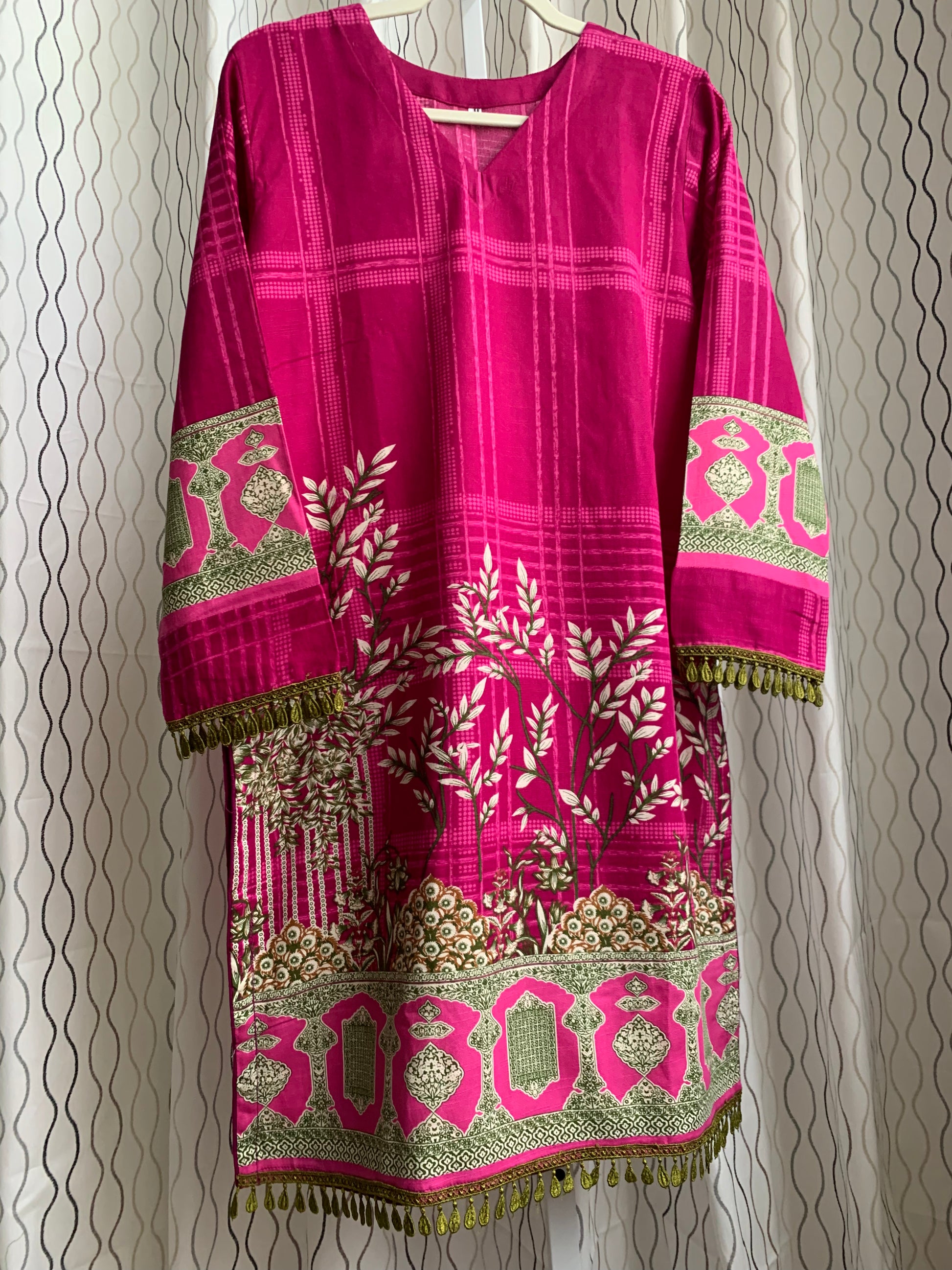 Modest Khaddar Suit for Women: it offers a Modest Relax Fit Style along with Custom Stitch. Crafted with Exotic Khaddar Fabric, which is a blend of Organic Cotton and Wool Slub. This 3 piece suit includes one Tunic, matching Trouser and a full Shawl, perfect for the winter season. Available in Magenta/ HotPink color with S-M-L-XL  sizes, and guarantees both comfort and elegance.