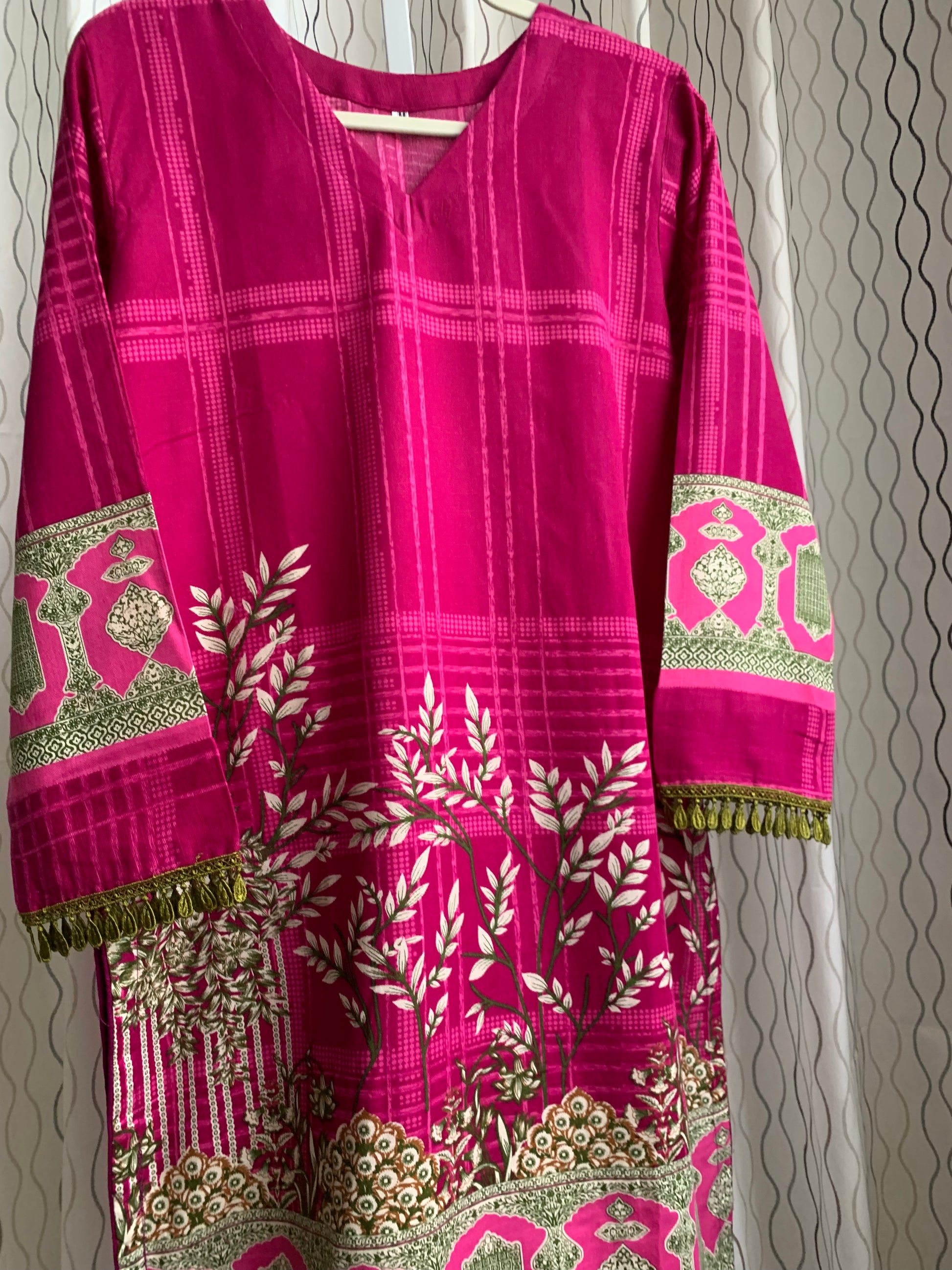 Modest Khaddar Suit for Women: it offers a Modest Relax Fit Style along with Custom Stitch. Crafted with Exotic Khaddar Fabric, which is a blend of Organic Cotton and Wool Slub. This 3 piece suit includes one Tunic, matching Trouser and a full Shawl, perfect for the winter season. Available in Magenta/ HotPink color with S-M-L-XL  sizes, and guarantees both comfort and elegance.