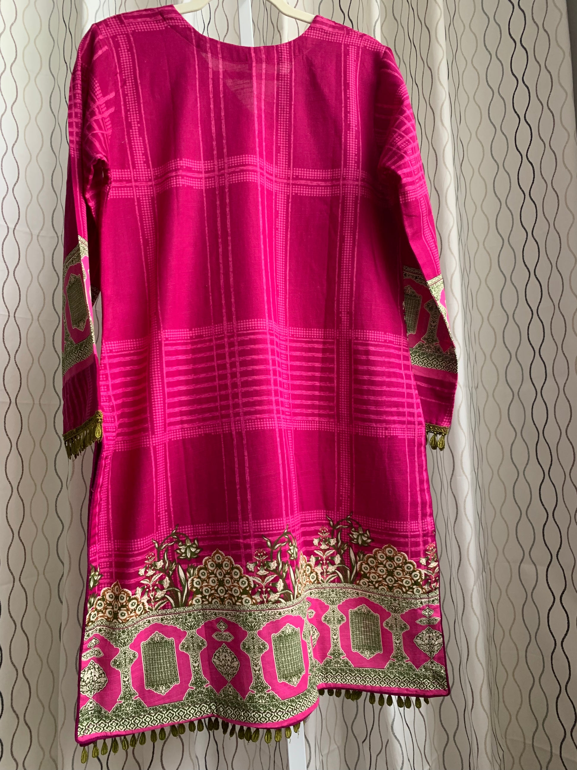 Modest Khaddar Suit for Women: it offers a Modest Relax Fit Style along with Custom Stitch. Crafted with Exotic Khaddar Fabric, which is a blend of Organic Cotton and Wool Slub. This 3 piece suit includes one Tunic, matching Trouser and a full Shawl, perfect for the winter season. Available in Magenta/ HotPink color with S-M-L-XL  sizes, and guarantees both comfort and elegance.