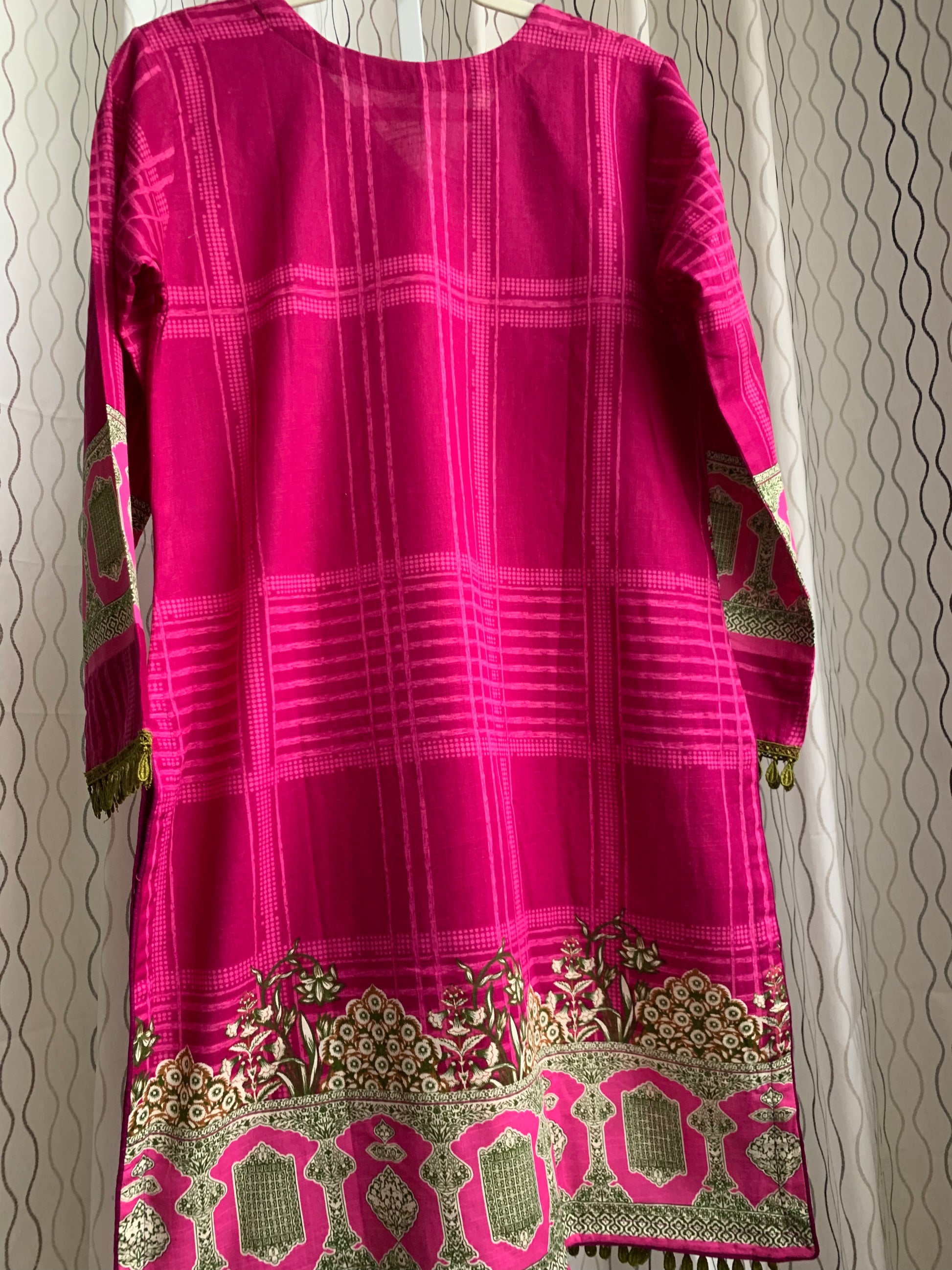 Modest Khaddar Suit for Women: it offers a Modest Relax Fit Style along with Custom Stitch. Crafted with Exotic Khaddar Fabric, which is a blend of Organic Cotton and Wool Slub. This 3 piece suit includes one Tunic, matching Trouser and a full Shawl, perfect for the winter season. Available in Magenta/ HotPink color with S-M-L-XL  sizes, and guarantees both comfort and elegance.