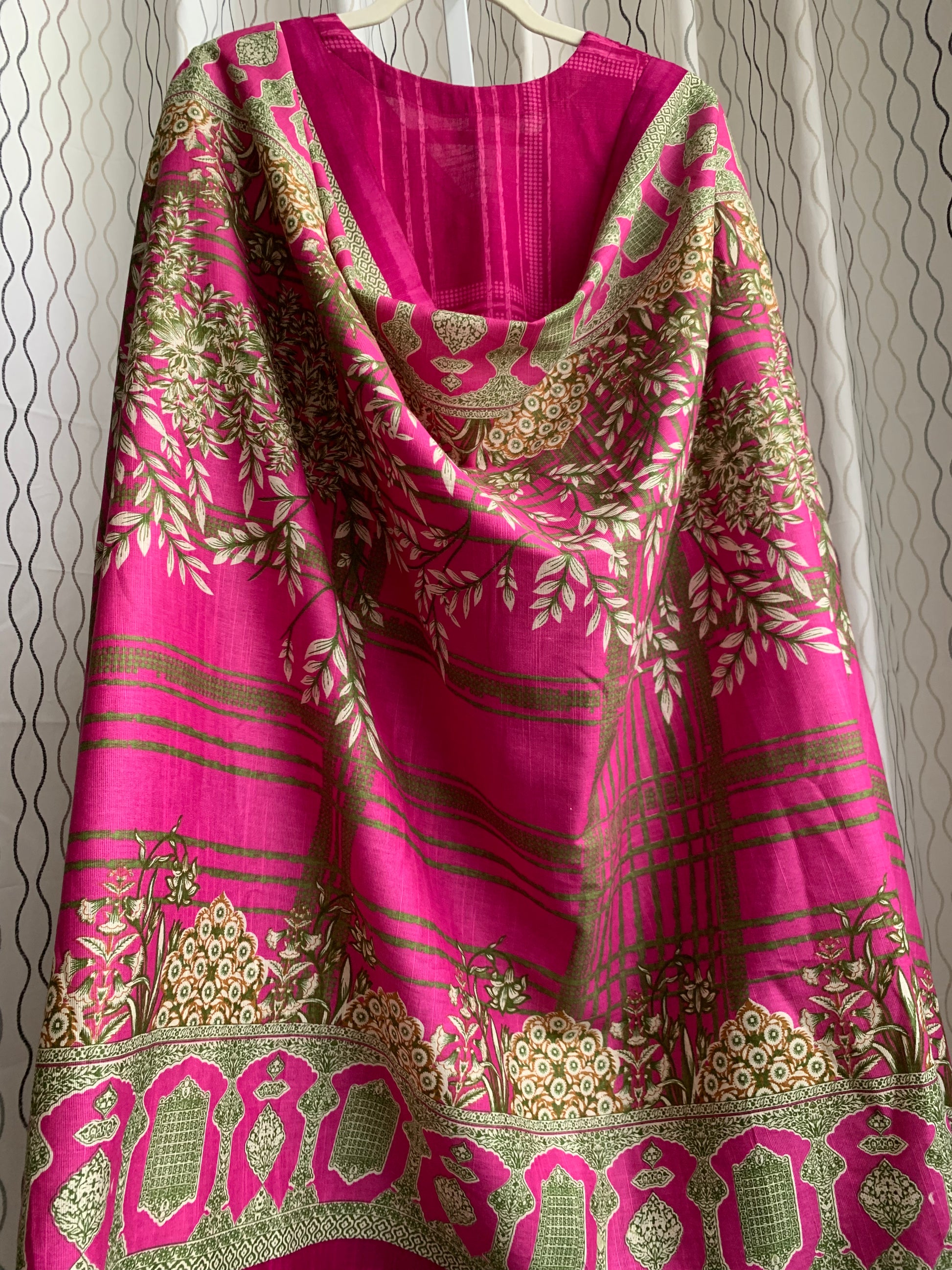 Modest Khaddar Suit for Women: it offers a Modest Relax Fit Style along with Custom Stitch. Crafted with Exotic Khaddar Fabric, which is a blend of Organic Cotton and Wool Slub. This 3 piece suit includes one Tunic, matching Trouser and a full Shawl, perfect for the winter season. Available in Magenta/ HotPink color with S-M-L-XL  sizes, and guarantees both comfort and elegance.