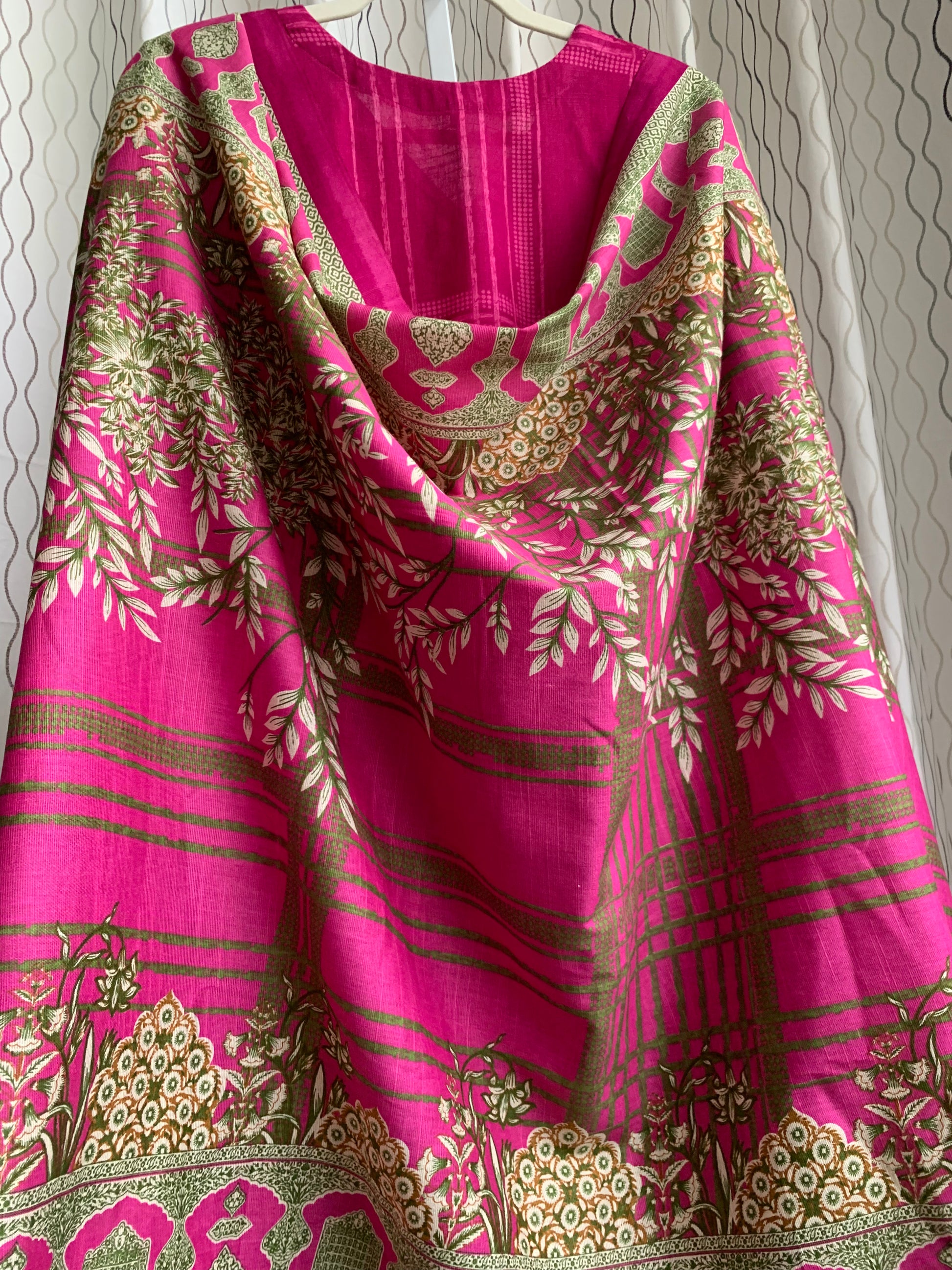 Modest Khaddar Suit for Women: it offers a Modest Relax Fit Style along with Custom Stitch. Crafted with Exotic Khaddar Fabric, which is a blend of Organic Cotton and Wool Slub. This 3 piece suit includes one Tunic, matching Trouser and a full Shawl, perfect for the winter season. Available in Magenta/ HotPink color with S-M-L-XL  sizes, and guarantees both comfort and elegance.