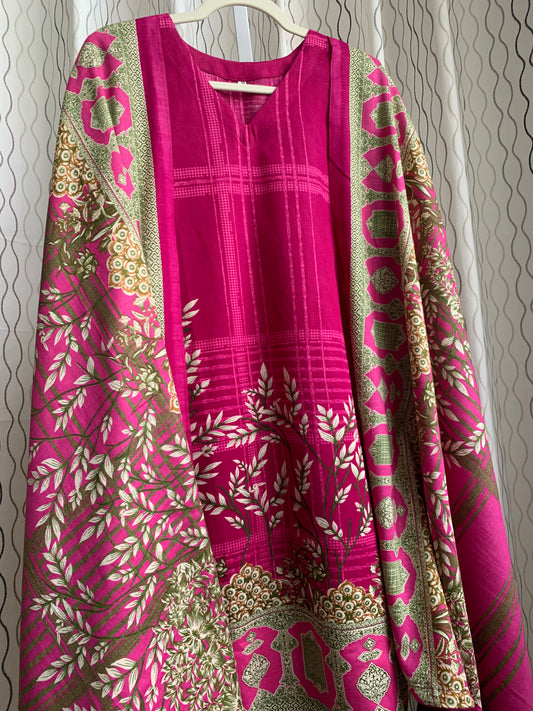 Modest Khaddar Suit for Women: it offers a Modest Relax Fit Style along with Custom Stitch. Crafted with Exotic Khaddar Fabric, which is a blend of Organic Cotton and Wool Slub. This 3 piece suit includes one Tunic, matching Trouser and a full Shawl, perfect for the winter season. Available in Magenta/ HotPink color with S-M-L-XL  sizes, and guarantees both comfort and elegance.