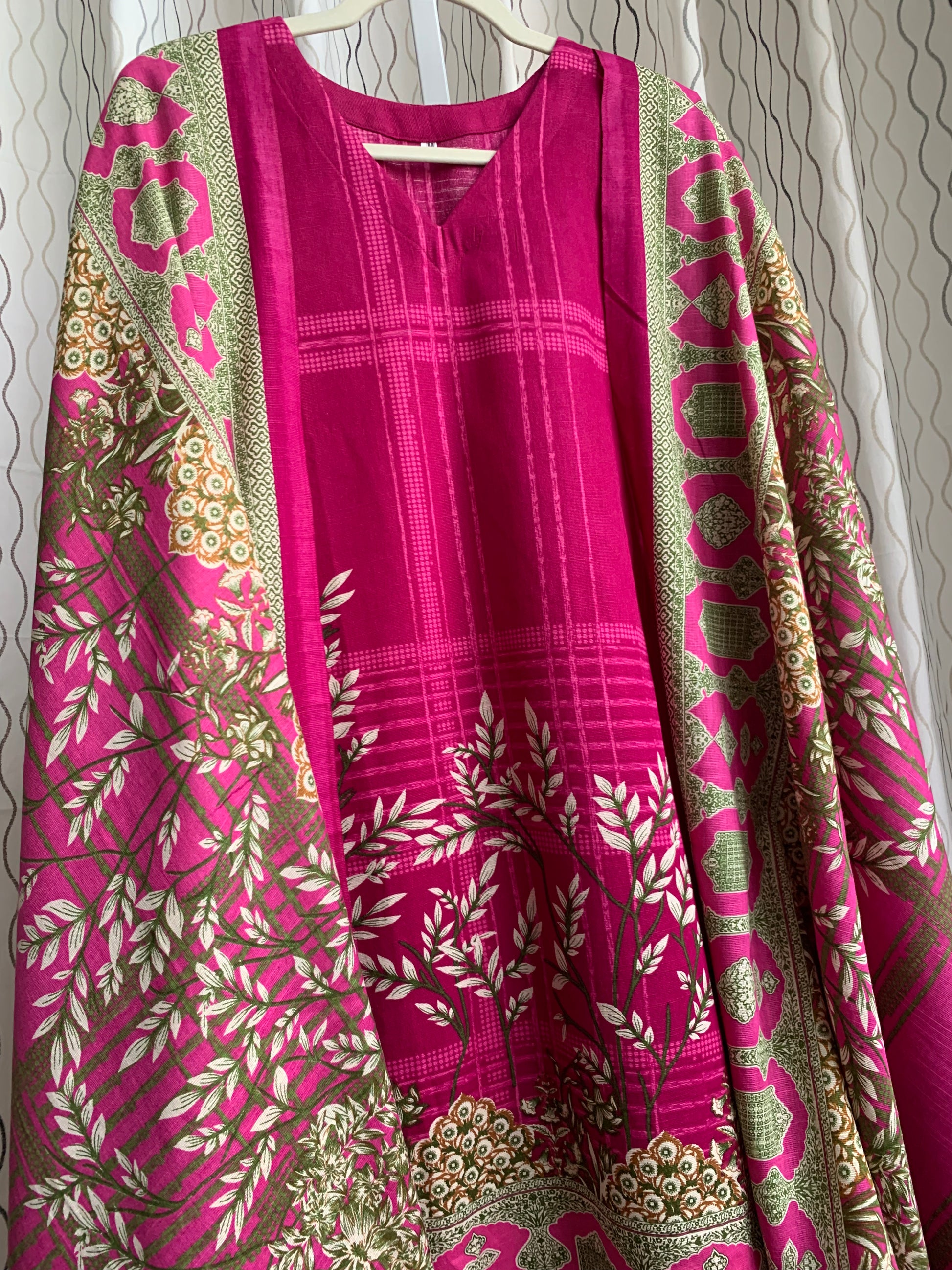 Modest Khaddar Suit for Women: it offers a Modest Relax Fit Style along with Custom Stitch. Crafted with Exotic Khaddar Fabric, which is a blend of Organic Cotton and Wool Slub. This 3 piece suit includes one Tunic, matching Trouser and a full Shawl, perfect for the winter season. Available in Magenta/ HotPink color with S-M-L-XL  sizes, and guarantees both comfort and elegance.
