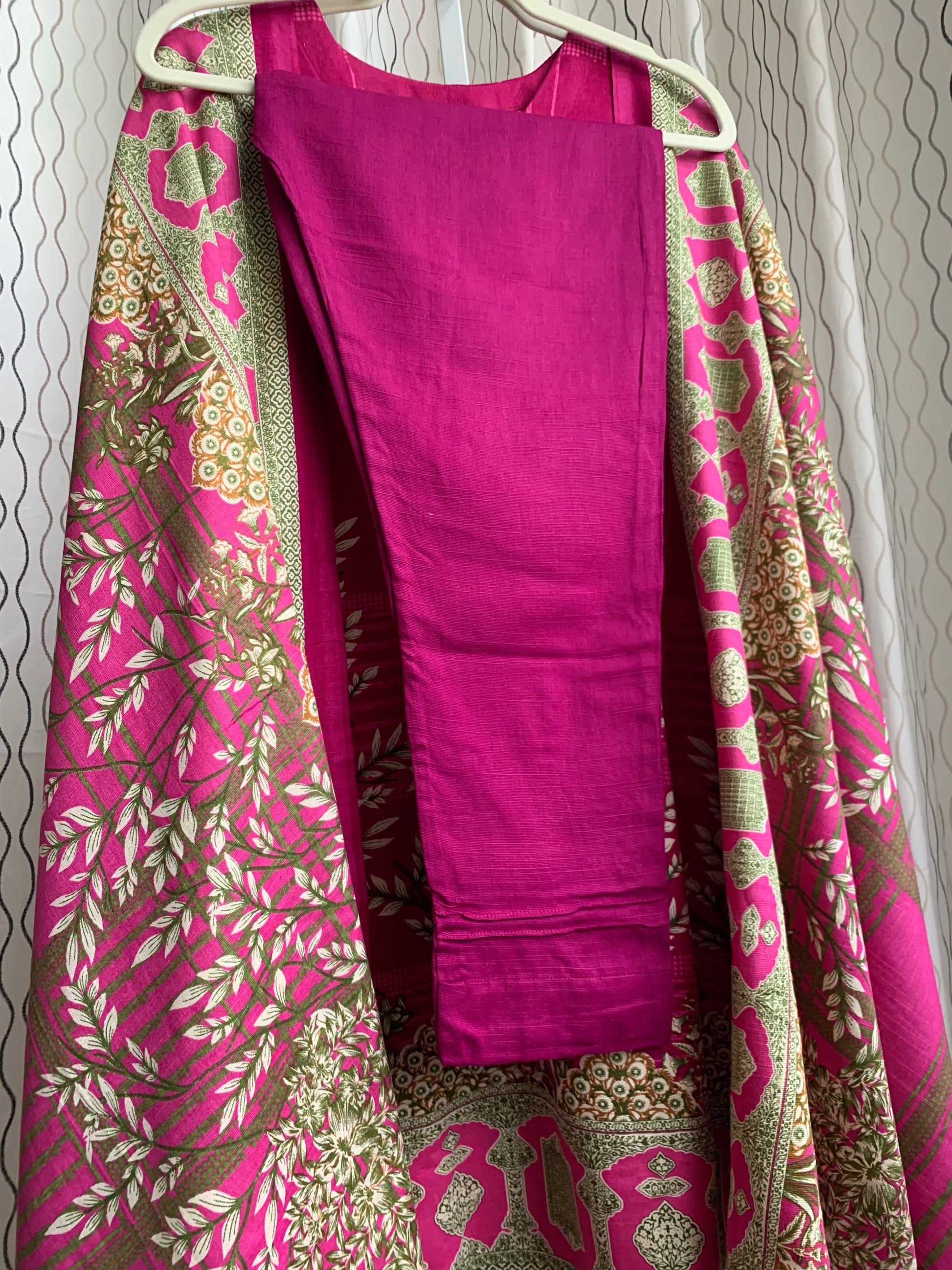 Modest Khaddar Suit for Women: it offers a Modest Relax Fit Style along with Custom Stitch. Crafted with Exotic Khaddar Fabric, which is a blend of Organic Cotton and Wool Slub. This 3 piece suit includes one Tunic, matching Trouser and a full Shawl, perfect for the winter season. Available in Magenta/ HotPink color with S-M-L-XL  sizes, and guarantees both comfort and elegance.