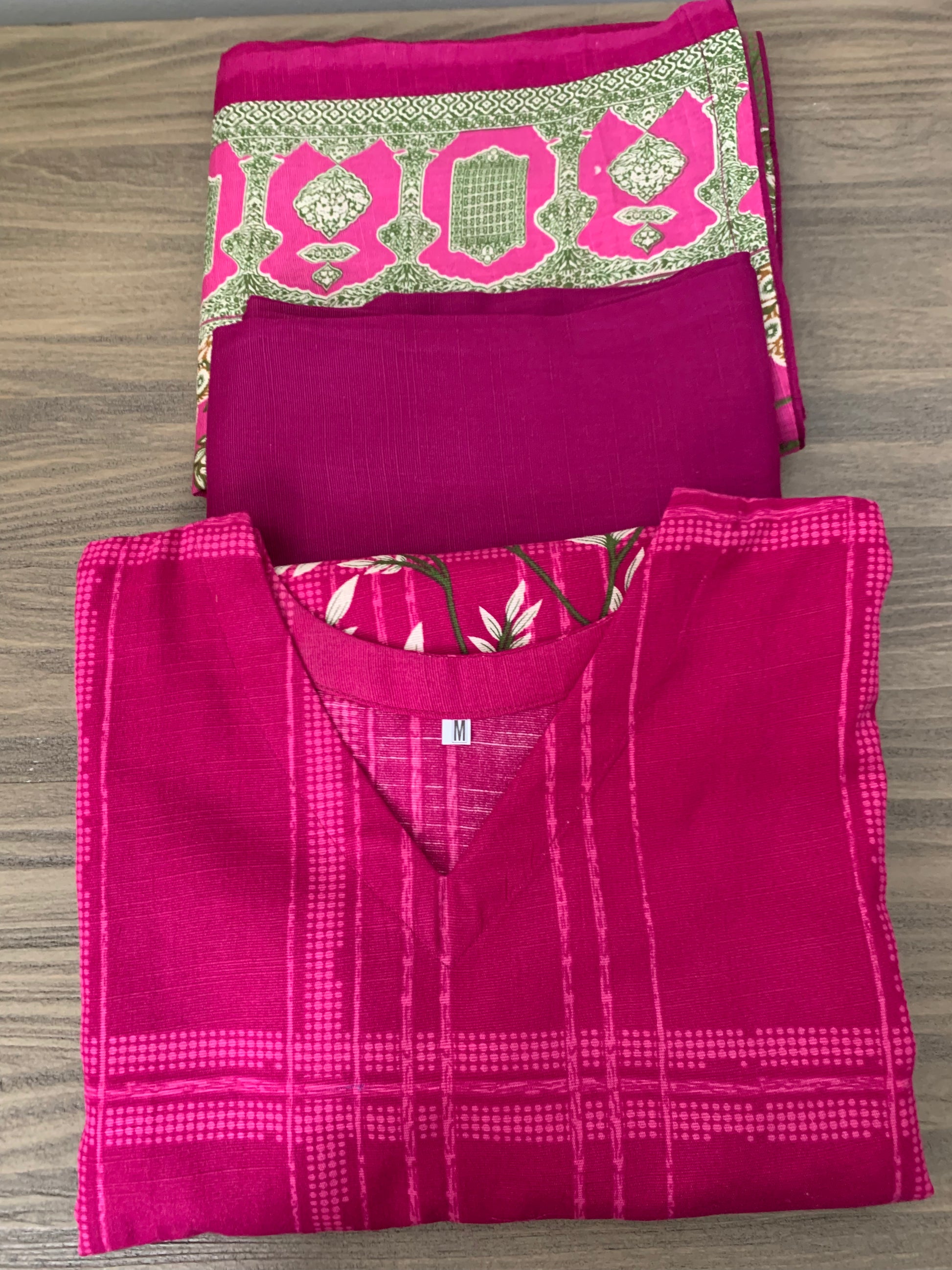 Modest Khaddar Suit for Women: it offers a Modest Relax Fit Style along with Custom Stitch. Crafted with Exotic Khaddar Fabric, which is a blend of Organic Cotton and Wool Slub. This 3 piece suit includes one Tunic, matching Trouser and a full Shawl, perfect for the winter season. Available in Magenta/ HotPink color with S-M-L-XL  sizes, and guarantees both comfort and elegance.