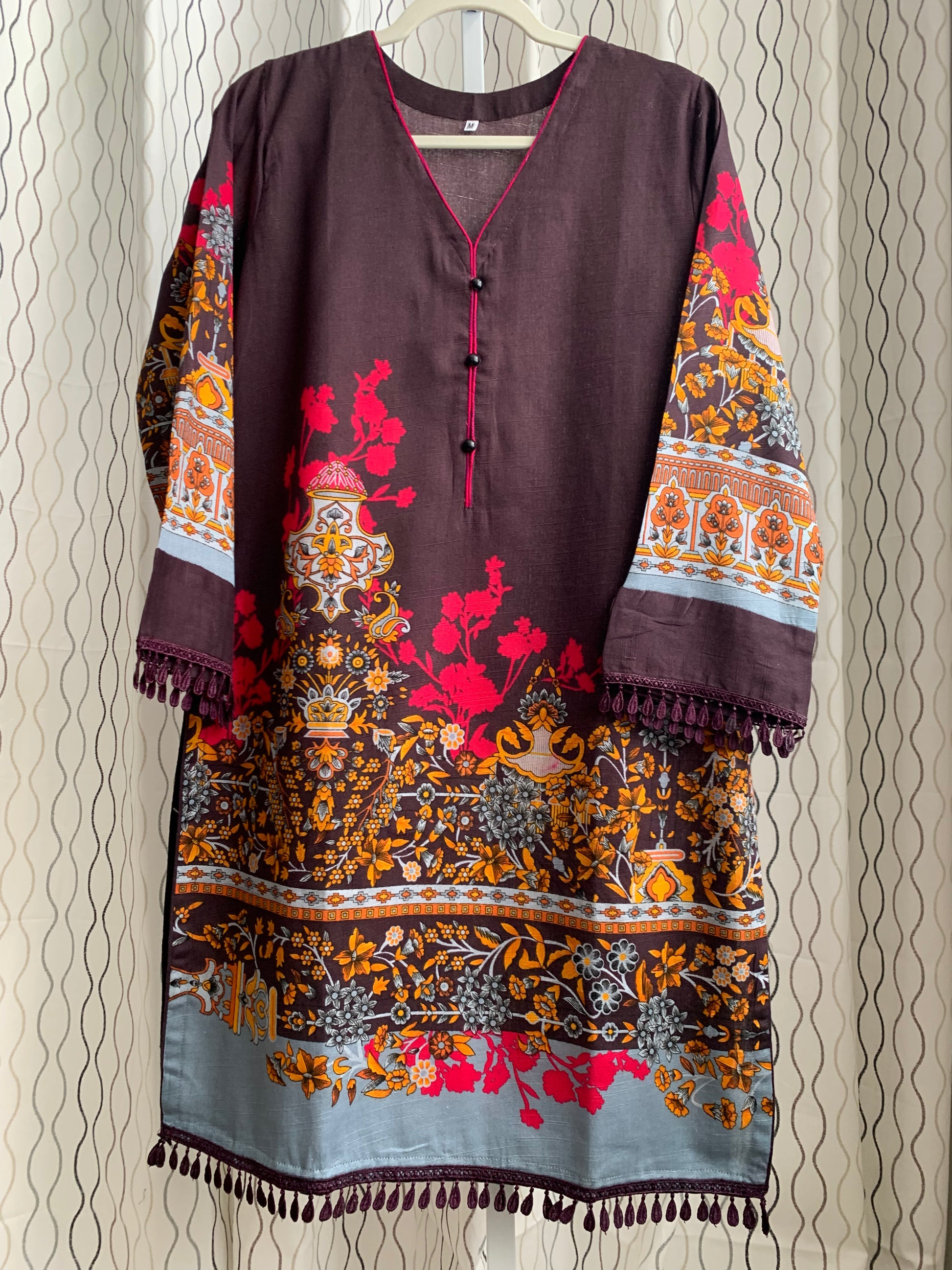 Modest Khaddar Suit for Women:  it offers a Modest Relax Fit Style along with Custom Stitch. Crafted with Exotic Khaddar Fabric, which is a blend of Organic Cotton and Wool Slub. This 3 piece suit includes one Tunic, matching Trouser and a full Shawl, perfect for the winter season. Available in Dark Brown color and S-M-L-XL  sizes, and guarantees both comfort and elegance.